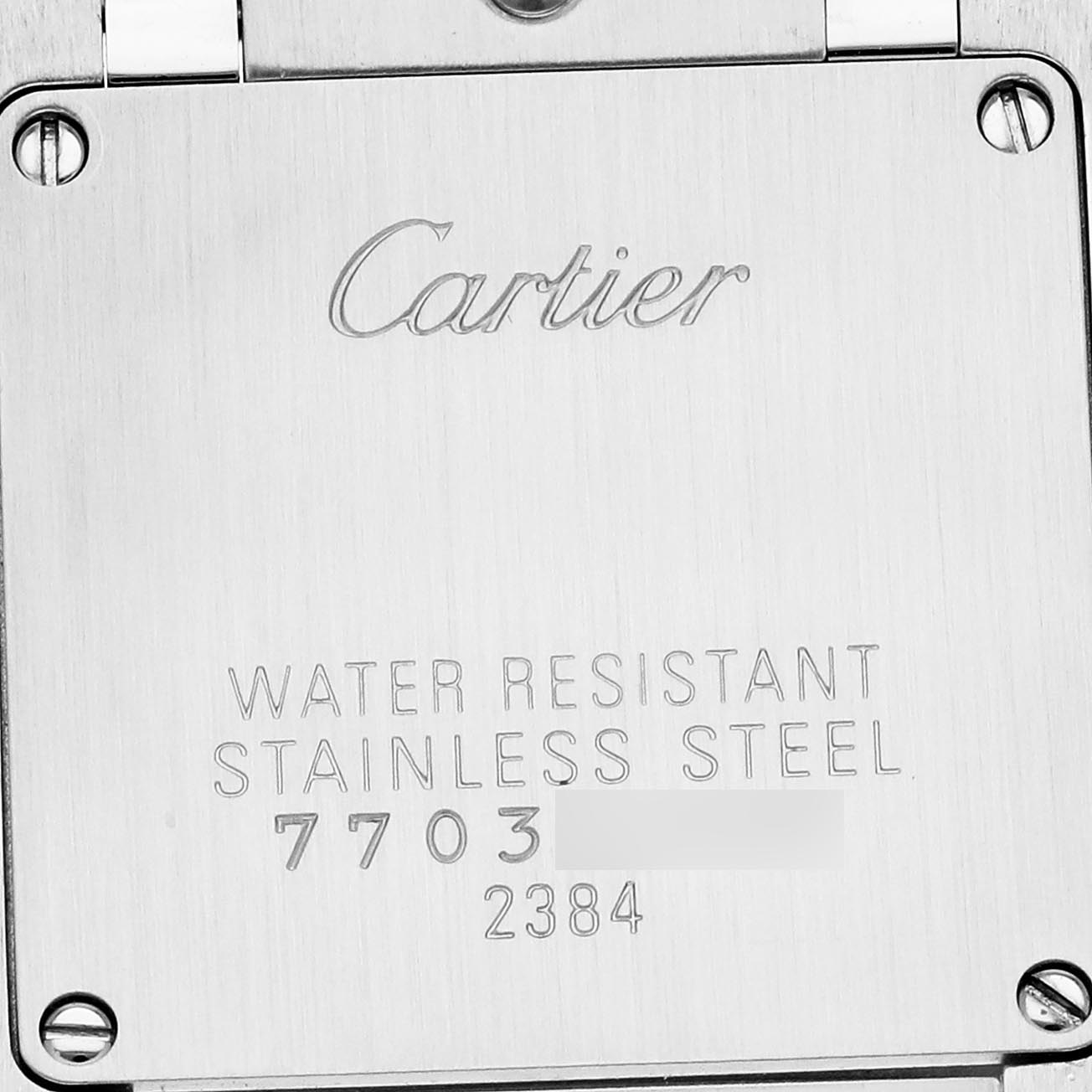 The image shows the back of a Cartier Tank Francaise W51027Q4 Women
s Steel and Gold (two tone) Mother of Pearl Dial W51027Q4 Women
s Steel and Gold (two tone) Mother of Pearl Dial watch, highlighting its stainless steel and water resistance markings.