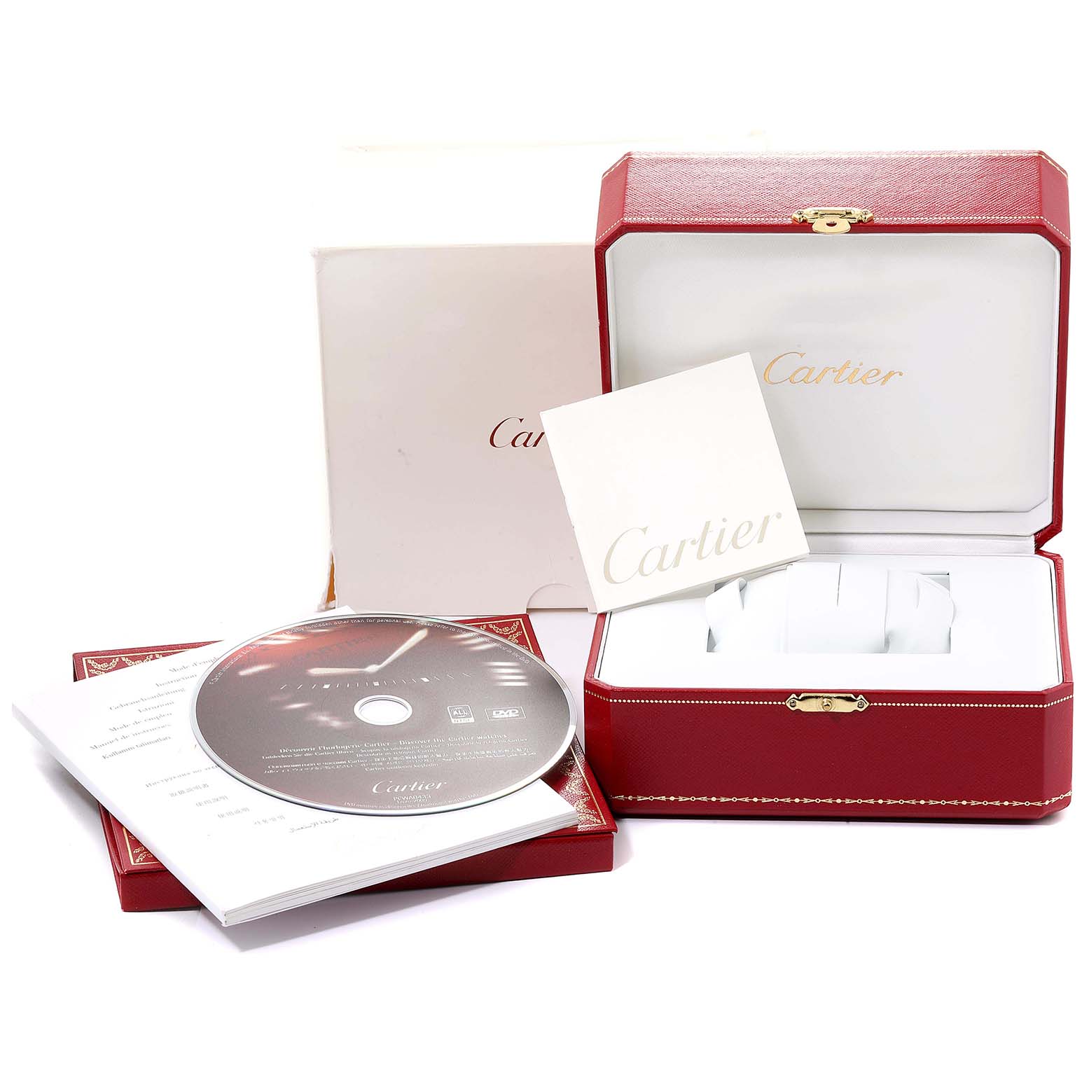 This image shows the packaging accessories of a Cartier Tank Solo W5200026 Men's Rose Gold Silver Dial W5200026 Men's Rose Gold Silver Dial watch, including a box, manual, and a CD.