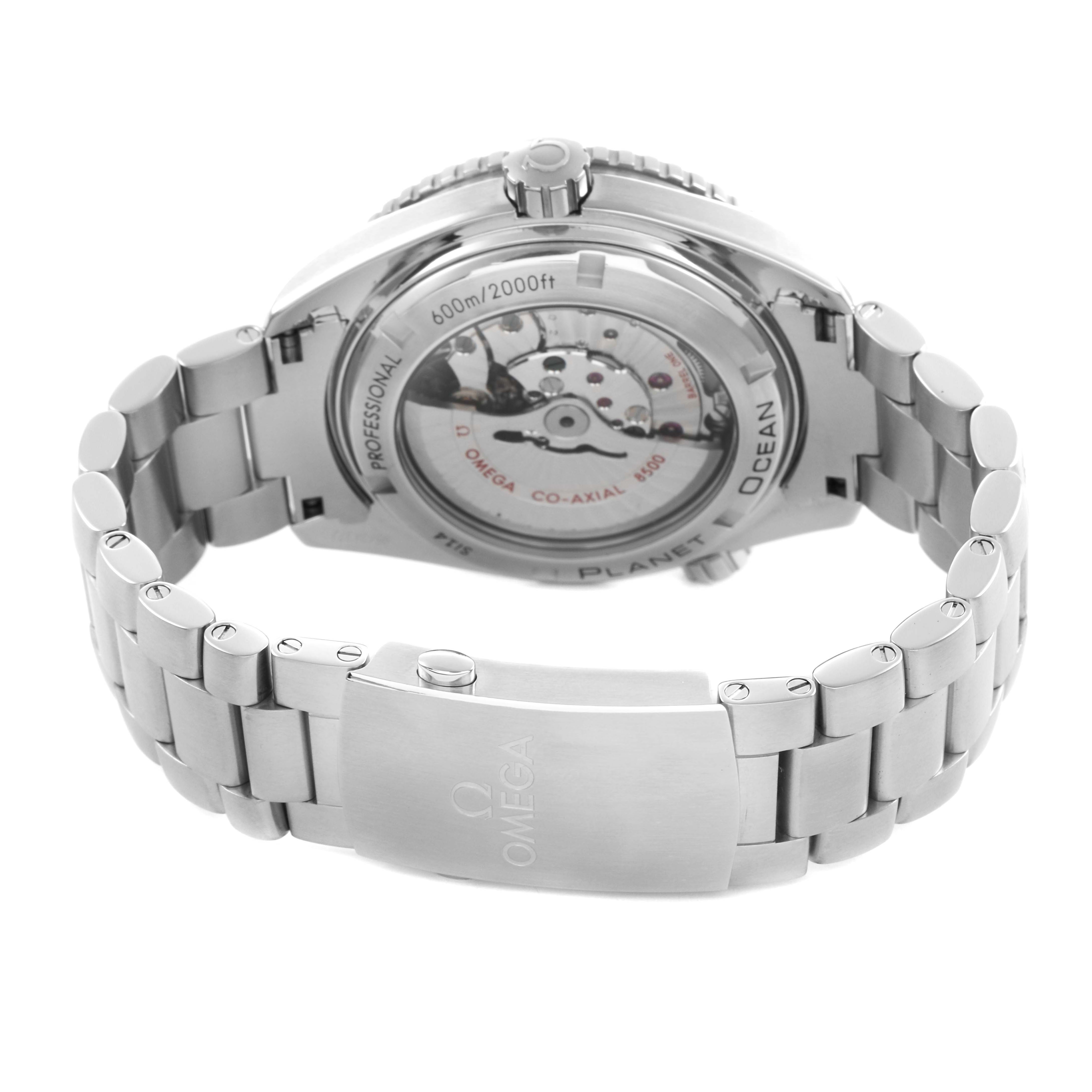 The Omega Planet Ocean 232.30.46.21.01.001 Men's Stainless Steel Black Dial watch is shown from the back, highlighting its movement through the transparent case back and bracelet clasp.