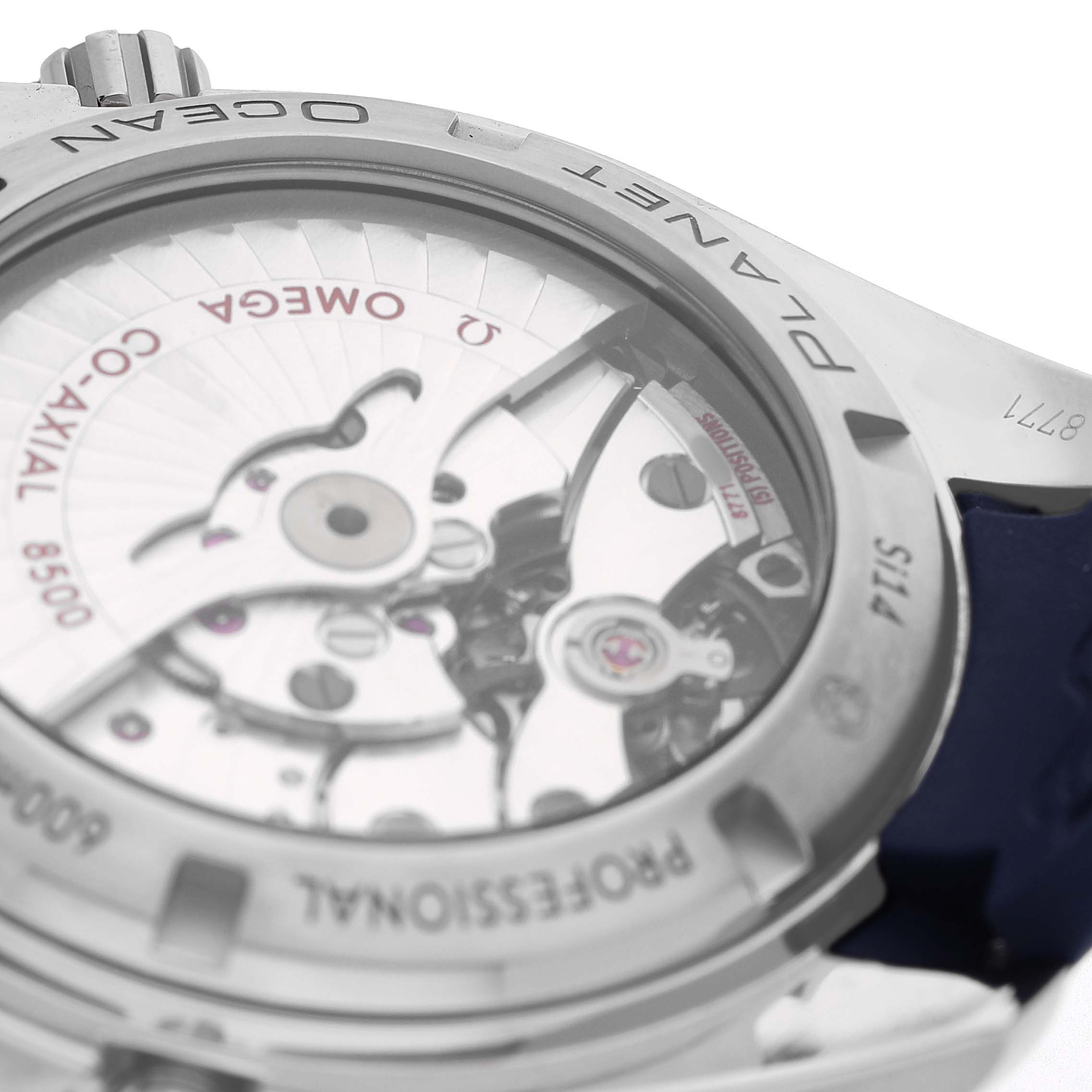 The image shows the transparent case back of an Omega Planet Ocean 232.92.42.21.03.001 Men's Titanium Blue Dial watch, highlighting the intricate movement and rotor.