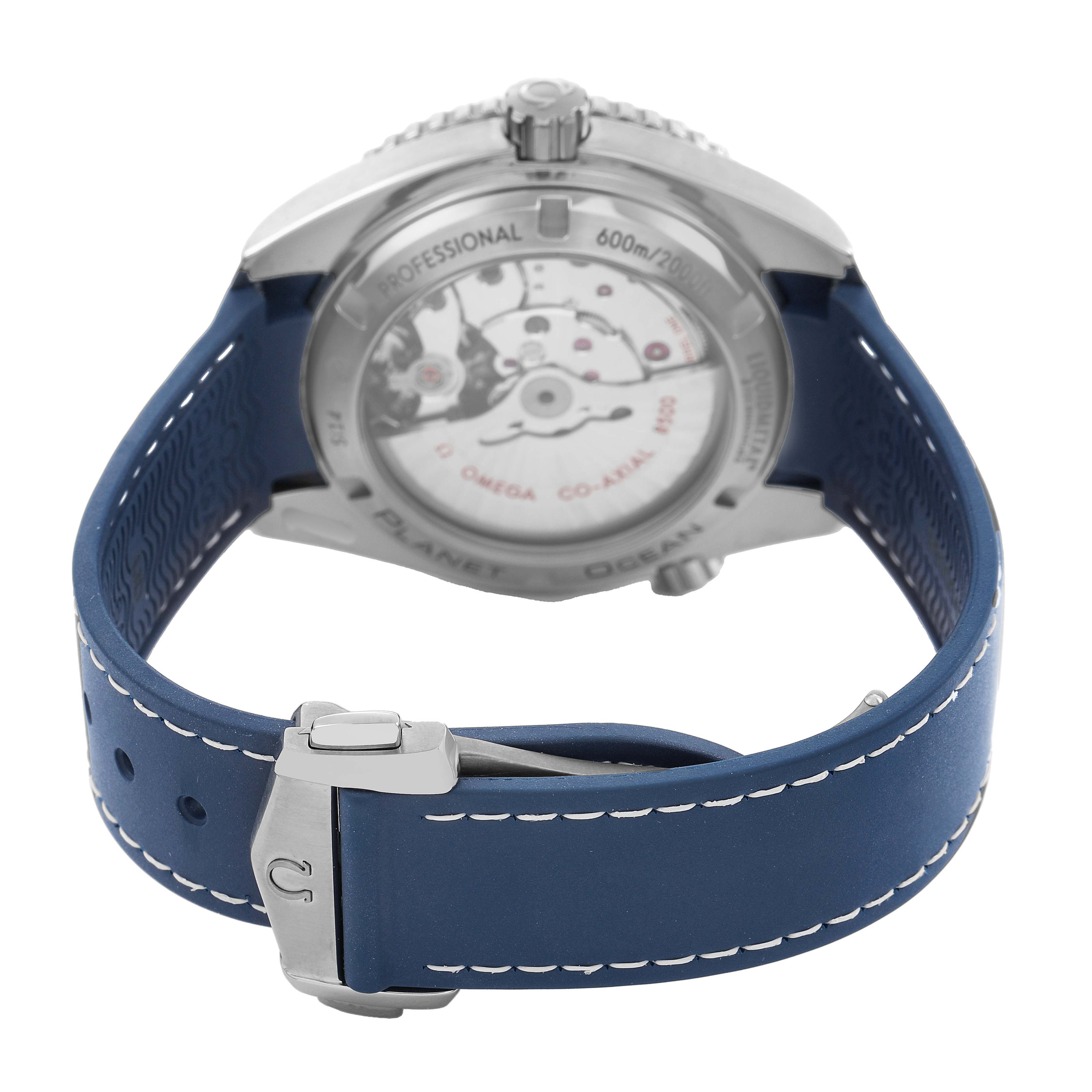 The image shows the back of the Omega Planet Ocean 232.92.42.21.03.001 Men's Titanium Blue Dial watch, highlighting the case back, strap, and clasp.