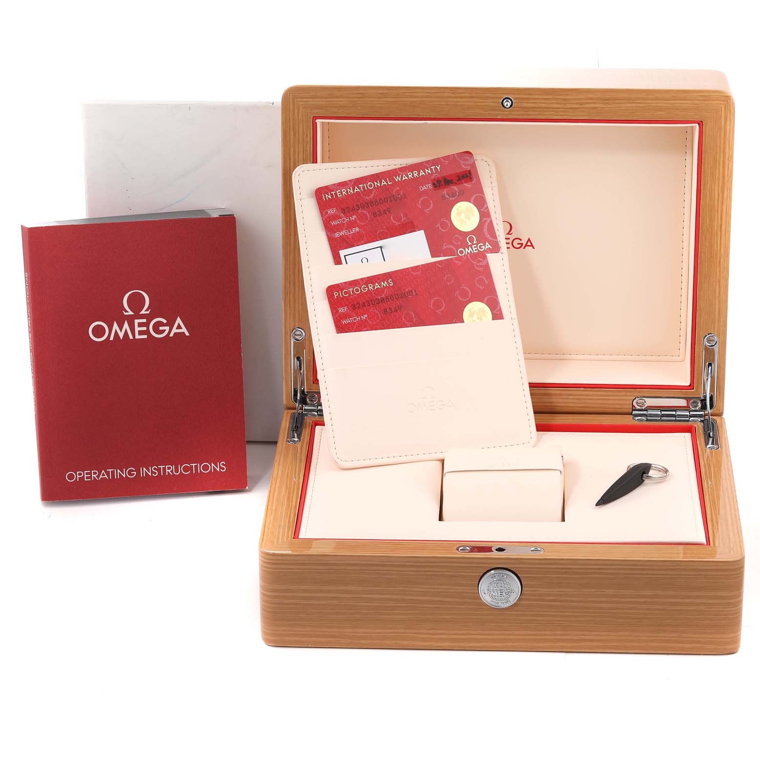 The image shows an Omega Speedmaster 324.30.38.50.01.001 Men's Stainless Steel Black Dial 324.30.38.50.01.001 Men's Stainless Steel Black Dial watch box, warranty cards, and an operating manual from a front angle.