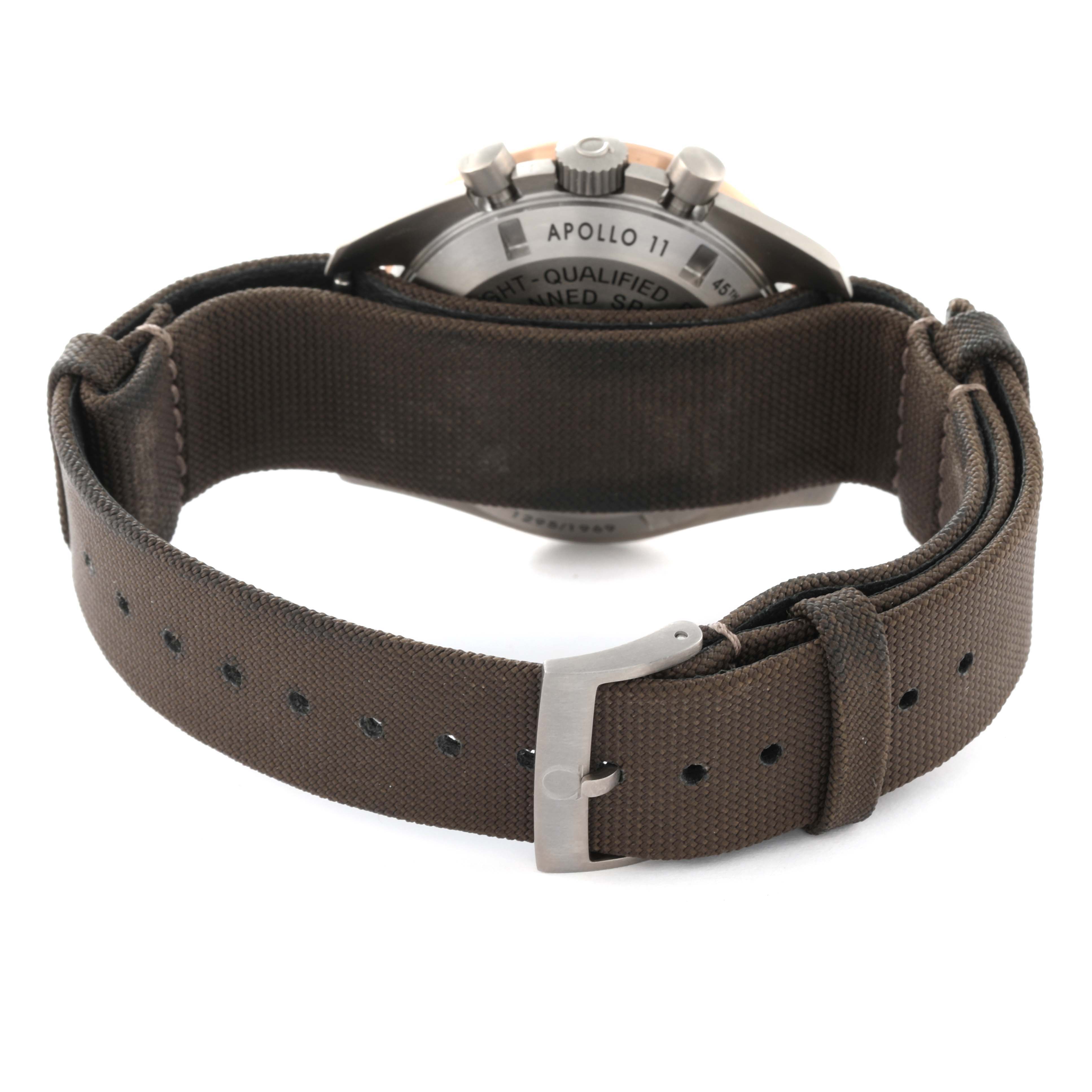 The image shows the backside and strap of an Omega Speedmaster 311.62.42.30.06.001 Men's Titanium Grey Dial 311.62.42.30.06.001 Men's Titanium Grey Dial watch, focusing on the clasp and caseback details.