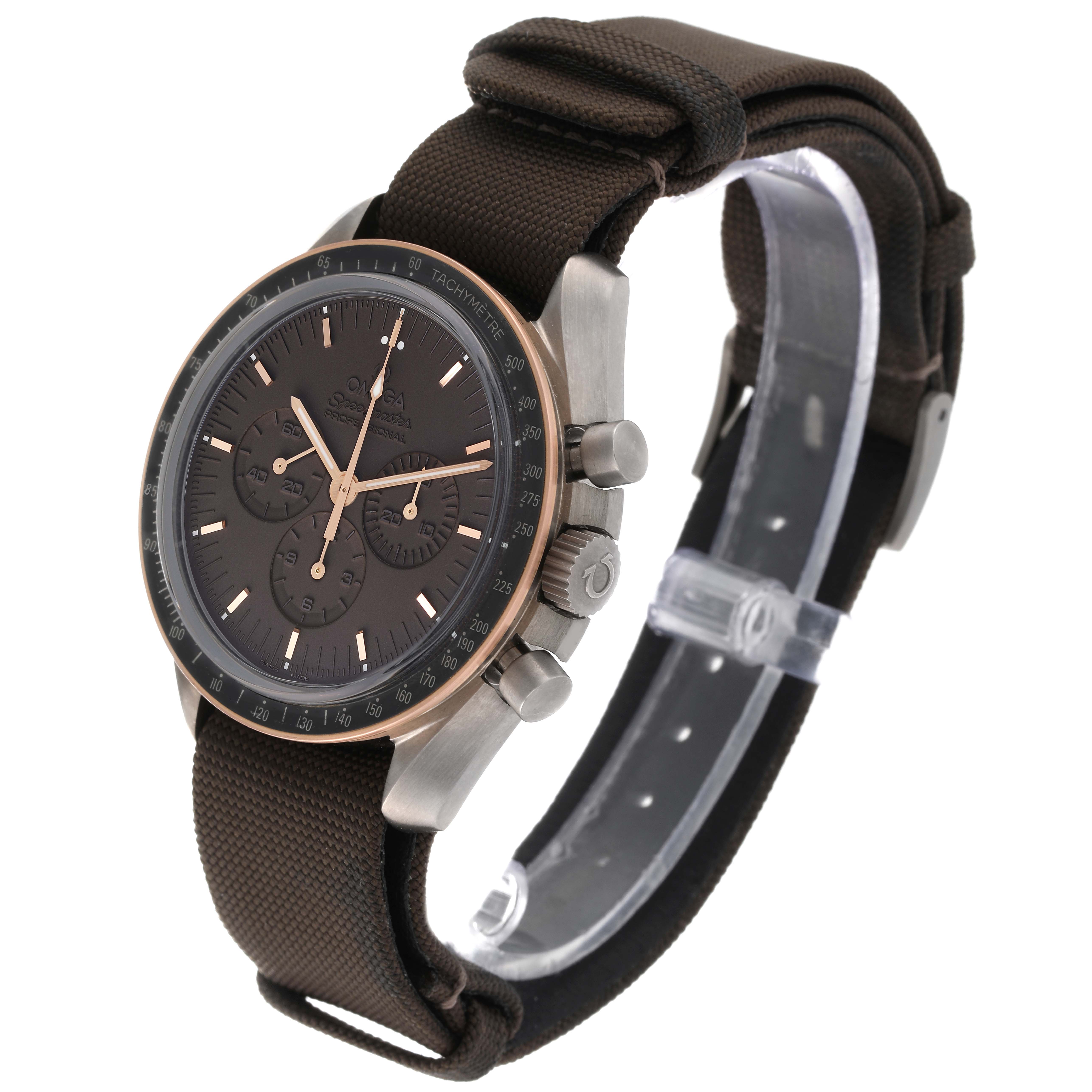 The Omega Speedmaster 311.62.42.30.06.001 Men's Titanium Grey Dial 311.62.42.30.06.001 Men's Titanium Grey Dial watch is shown at a three-quarter angle, displaying its face, side buttons, and fabric strap.