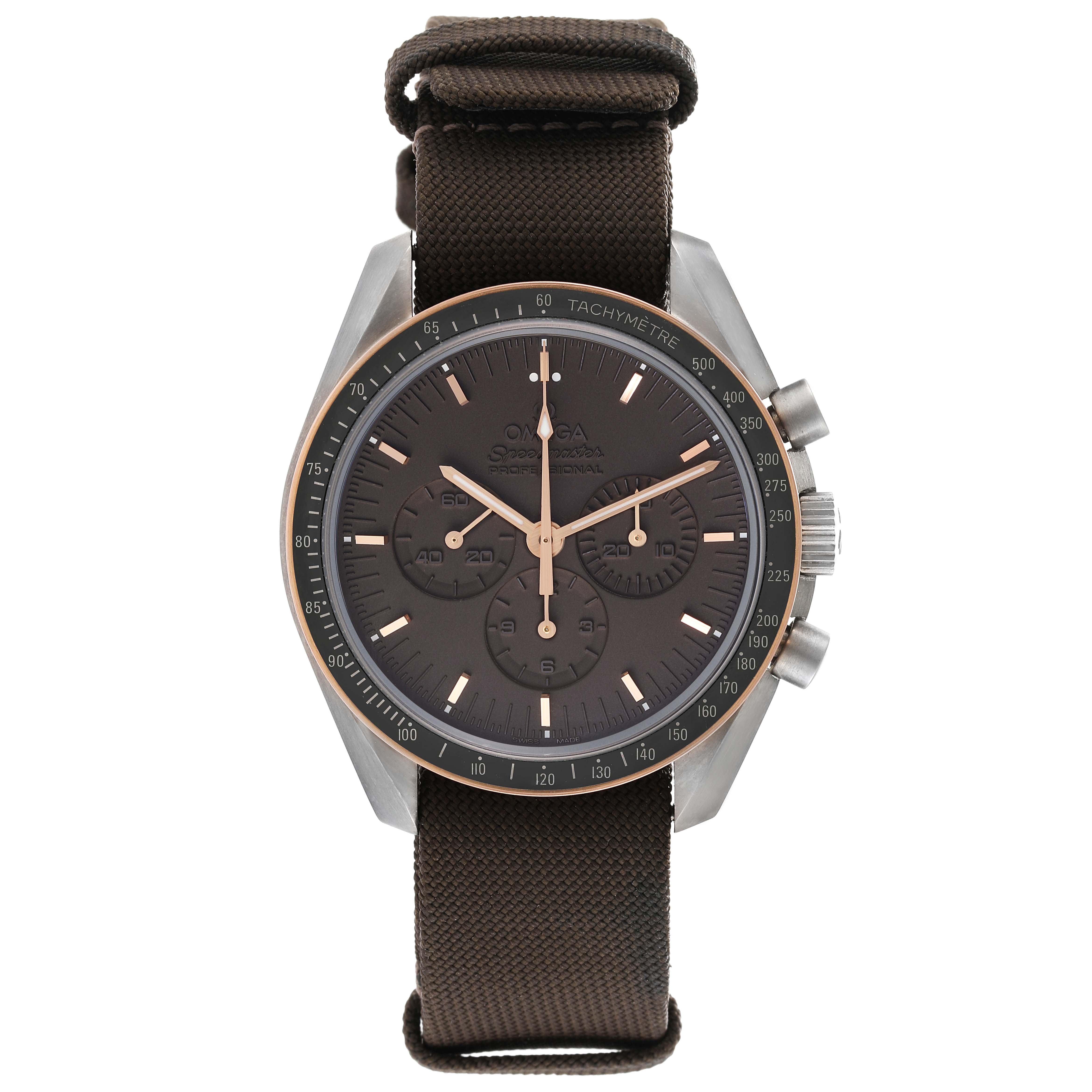 The image shows a front view of the Omega Speedmaster 311.62.42.30.06.001 Men's Titanium Grey Dial 311.62.42.30.06.001 Men's Titanium Grey Dial watch with a round dial, chronograph sub-dials, and a fabric strap.