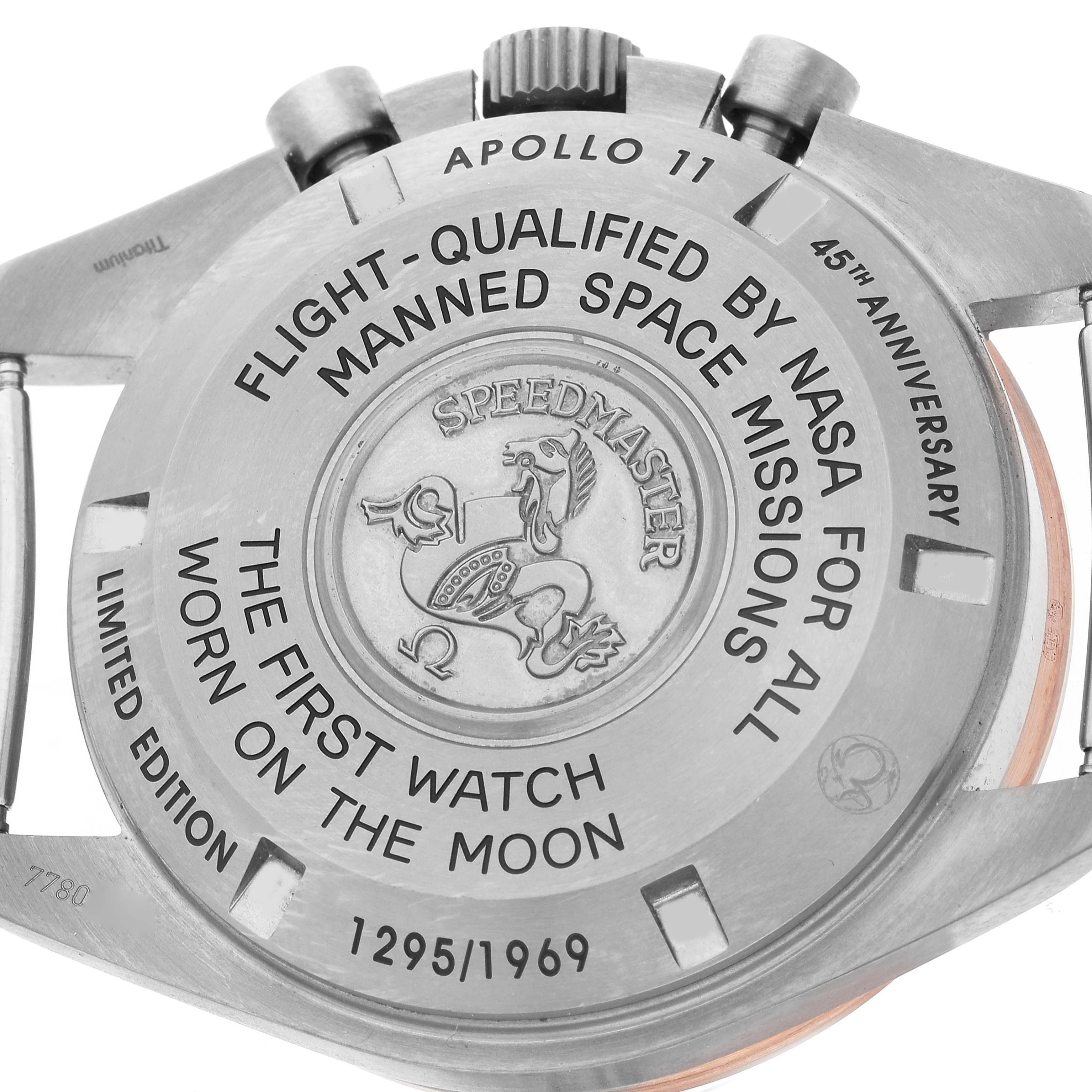 The image shows the case back of the Omega Speedmaster 311.62.42.30.06.001 Men's Titanium Grey Dial 311.62.42.30.06.001 Men's Titanium Grey Dial watch, featuring engravings commemorating the Apollo 11 mission and its edition number.