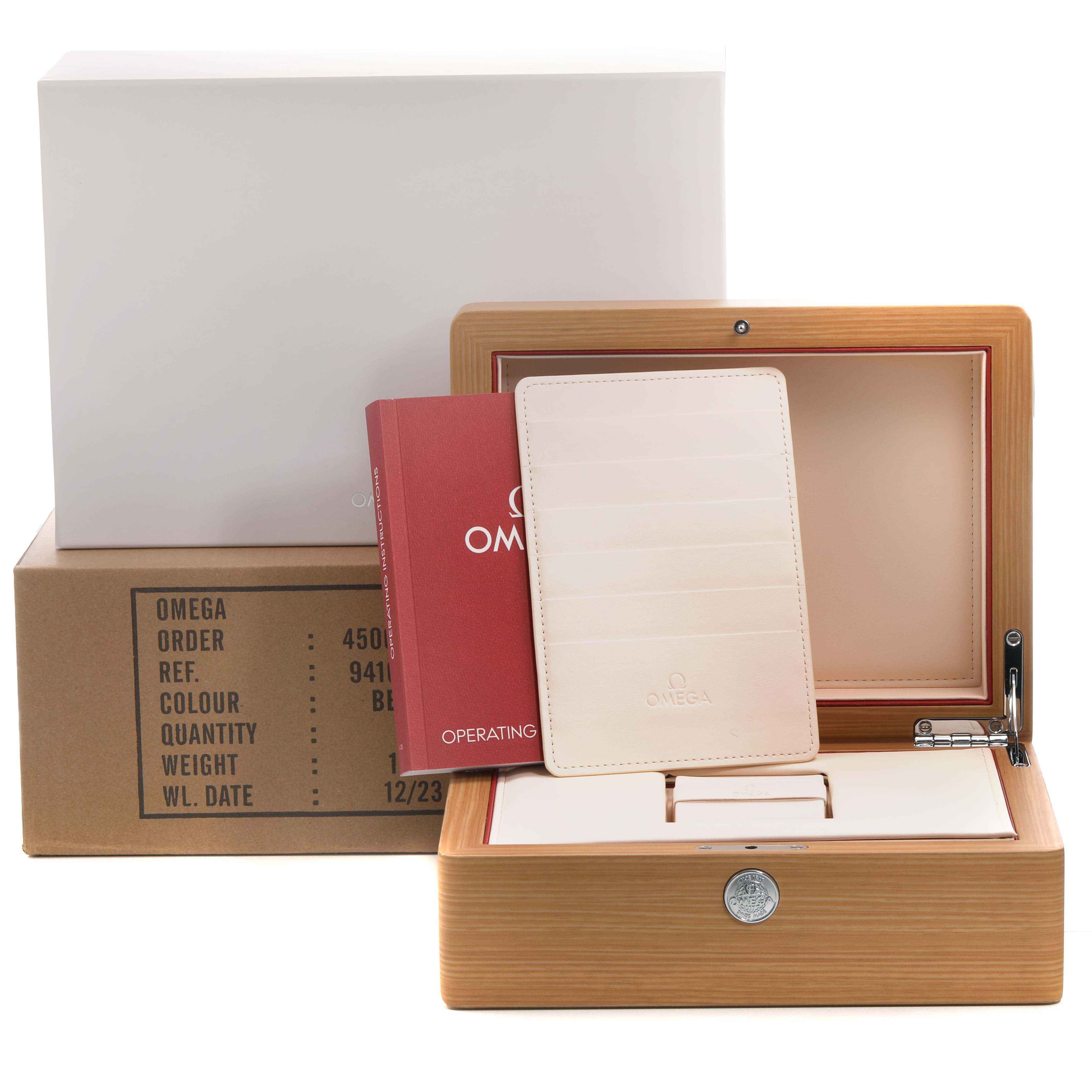 The image shows the packaging and accessories of an Omega Speedmaster 326.30.40.50.11.001 Men's Stainless Steel Red Dial, including a wooden box, user manual, and branded cardholder.