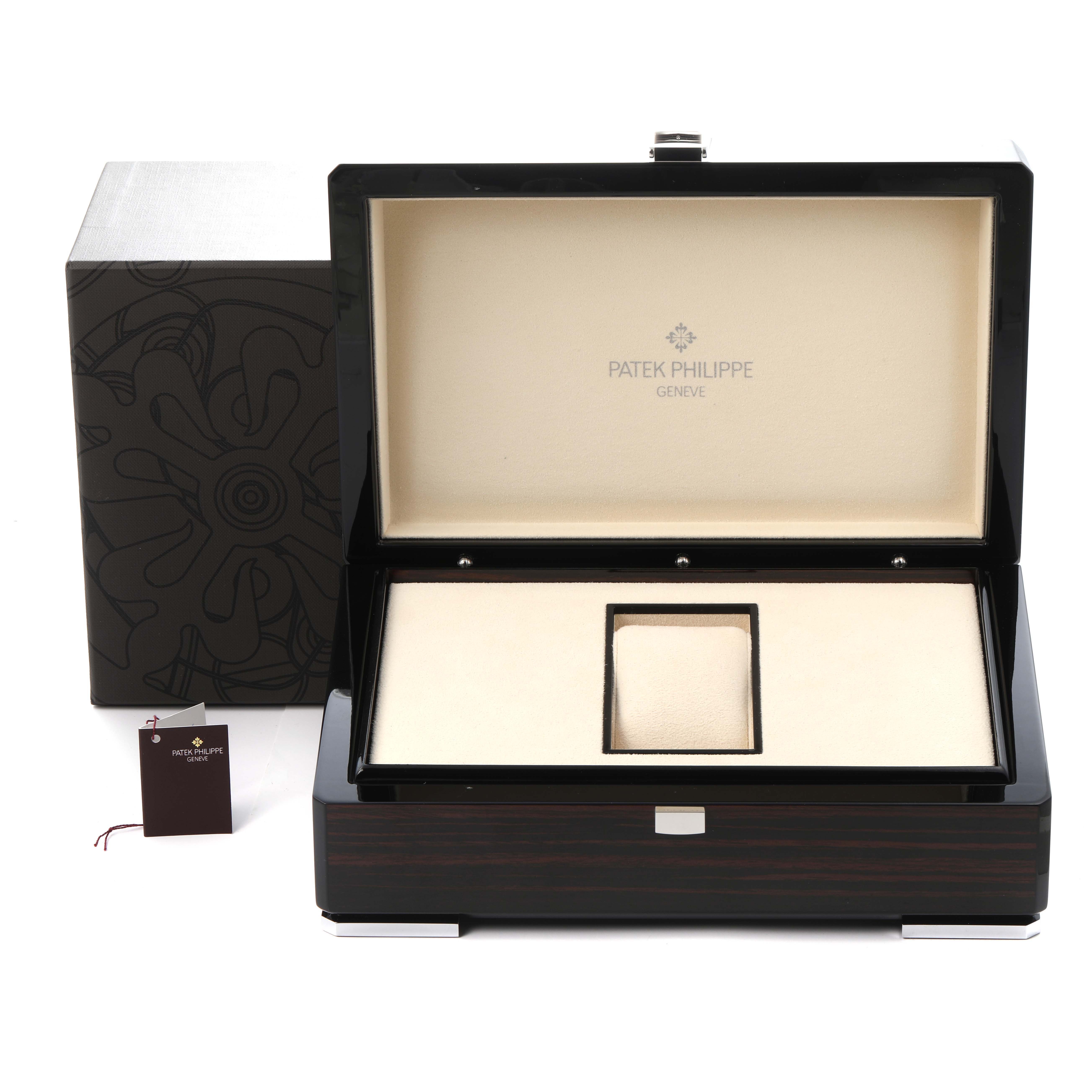 The image shows an open Patek Philippe Complications 5036/1G Men
s White Gold Black Dial 5036/1G Men
s White Gold Black Dial watch box from a frontal angle, featuring the inner lining and compartments.