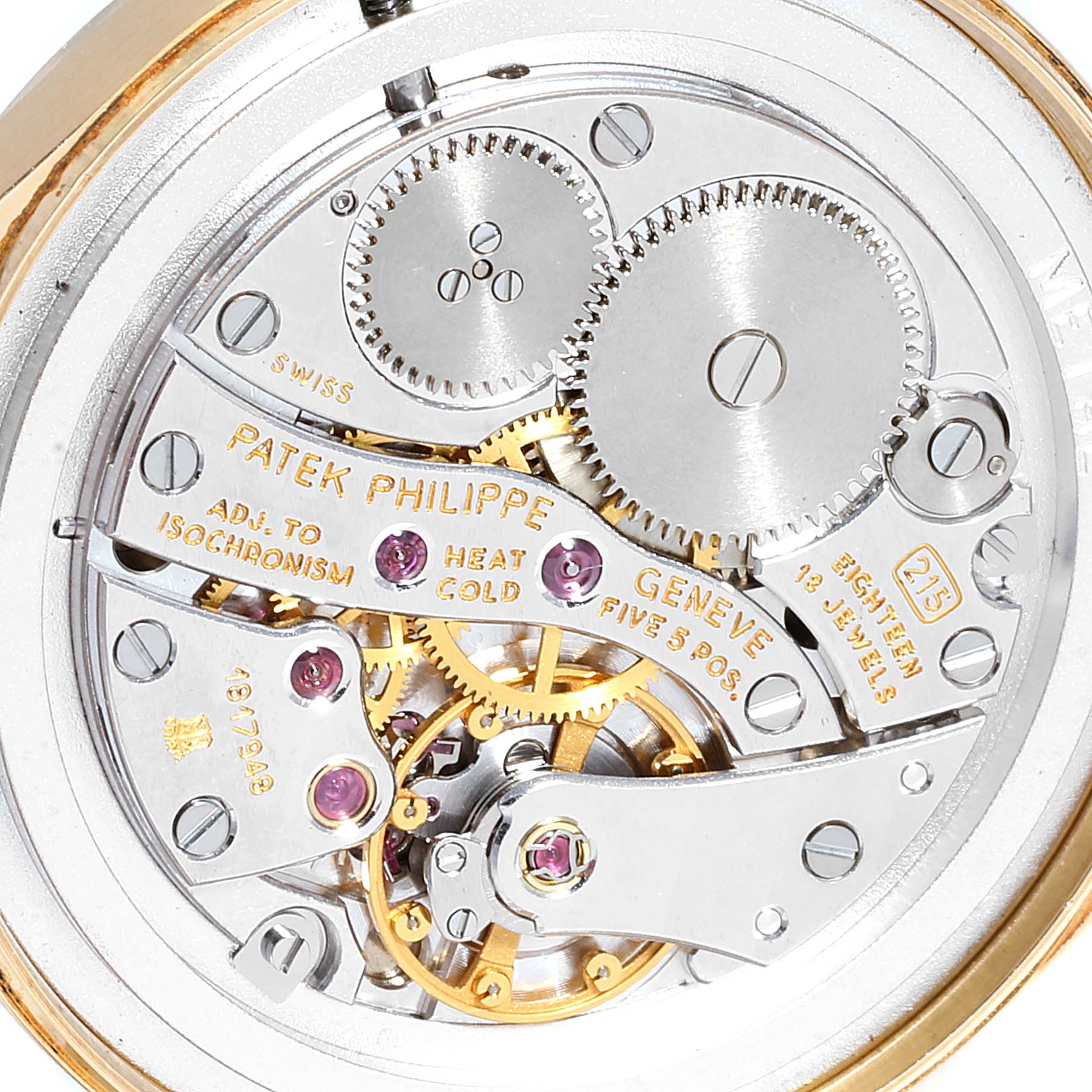 The image shows the intricate inner mechanical movement of a Vintage Patek Philippe watch.