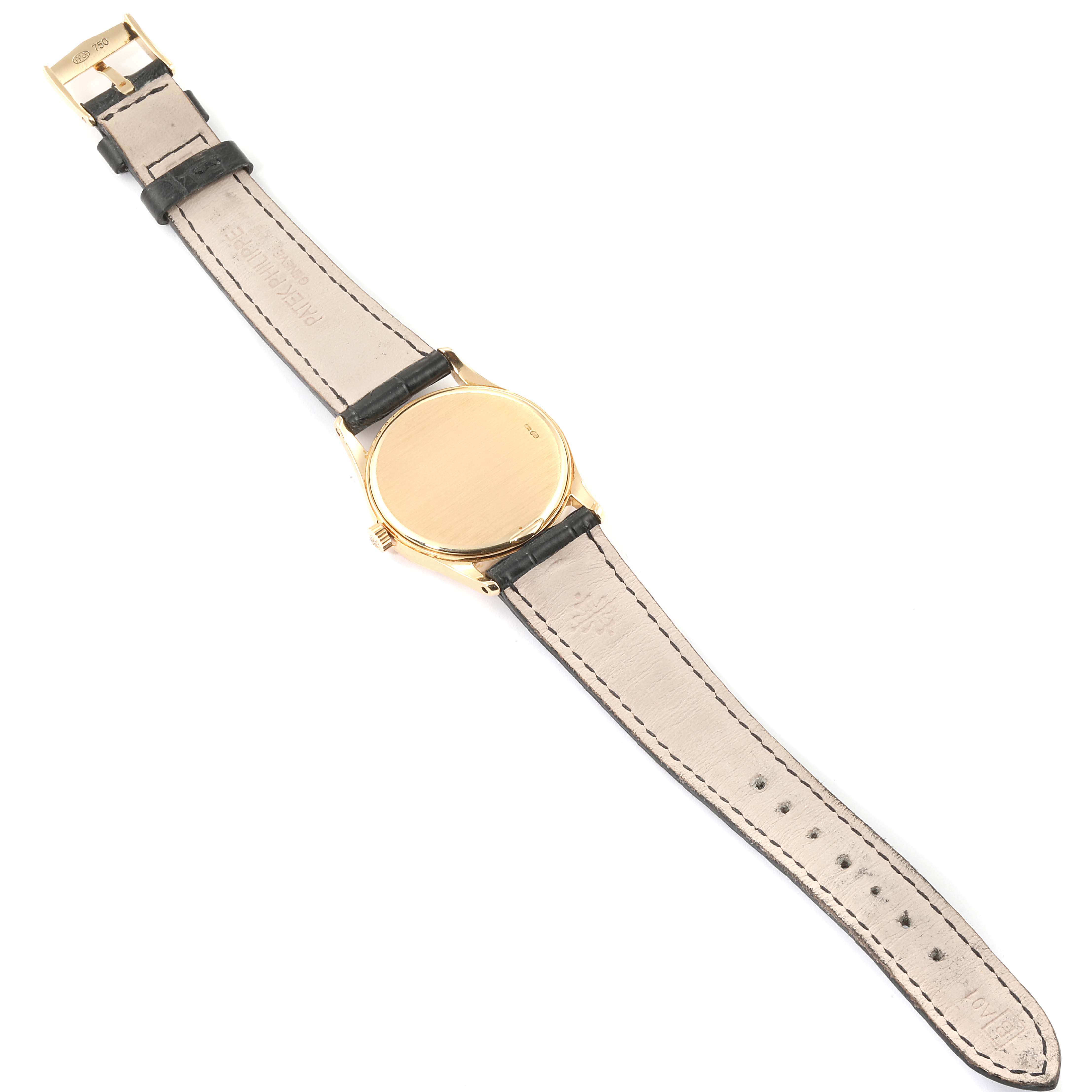 This image shows the back view of a Vintage Patek Philippe watch, displaying the strap and the case back.