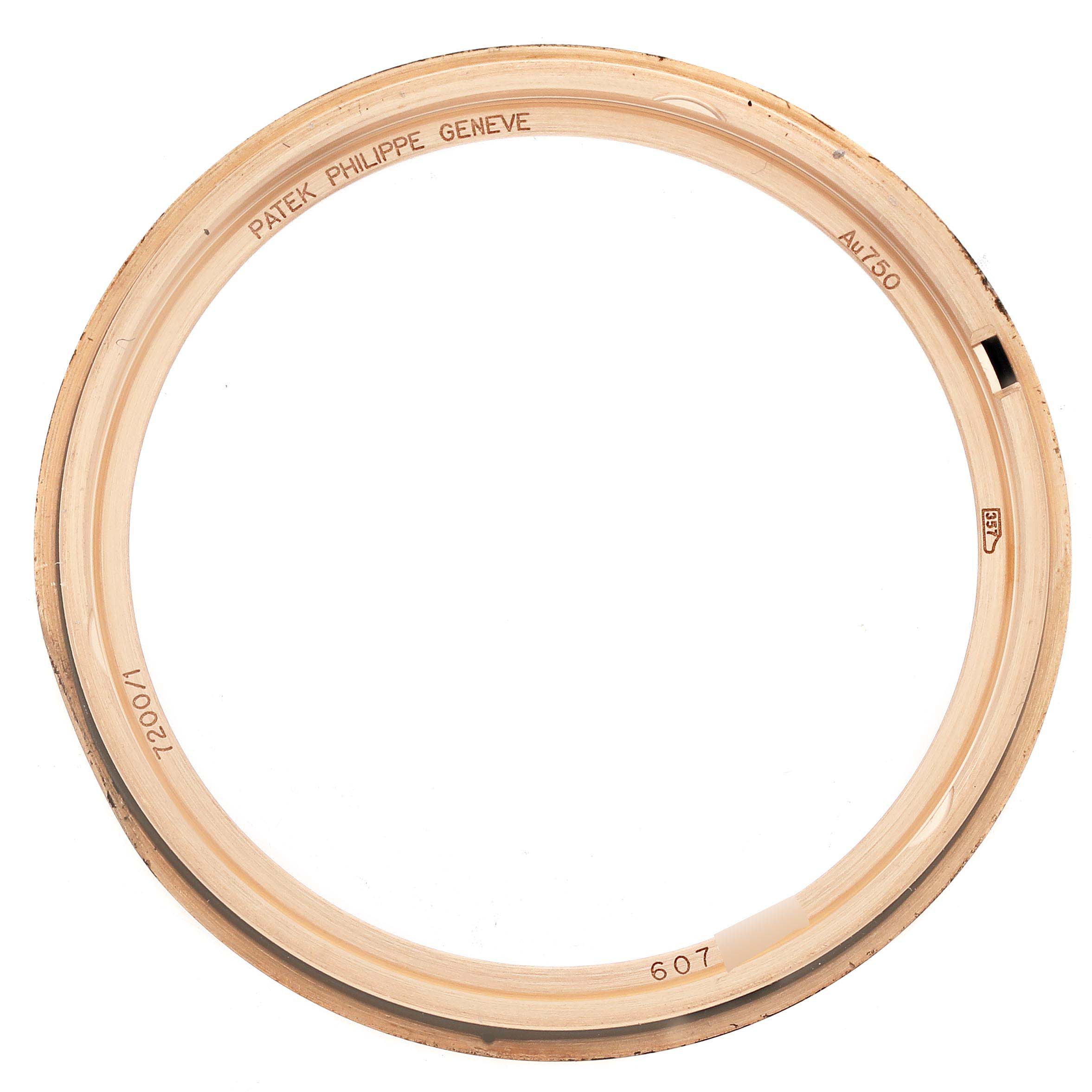 This image shows a close-up of the bezel for the Patek Philippe Calatrava 7200/1R-001 Men
s Rose Gold Silver Dial 7200/1R-001 Men
s Rose Gold Silver Dial, featuring engravings and no watch face.