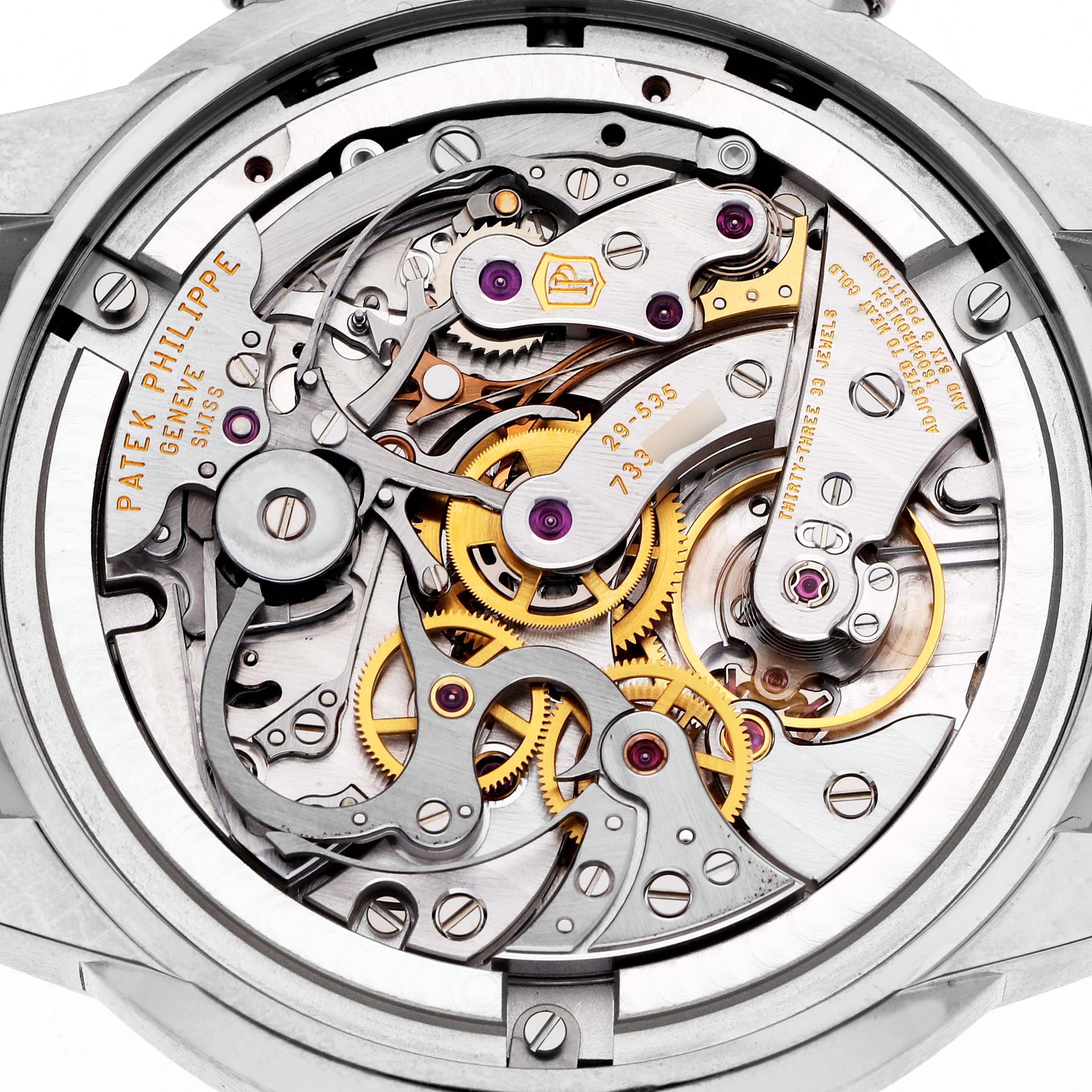 The image shows the intricate movement of a Patek Philippe Complications 5172G-001 Men
s White Gold Blue Dial 5172G-001 Men
s White Gold Blue Dial watch, viewed from the case back angle.