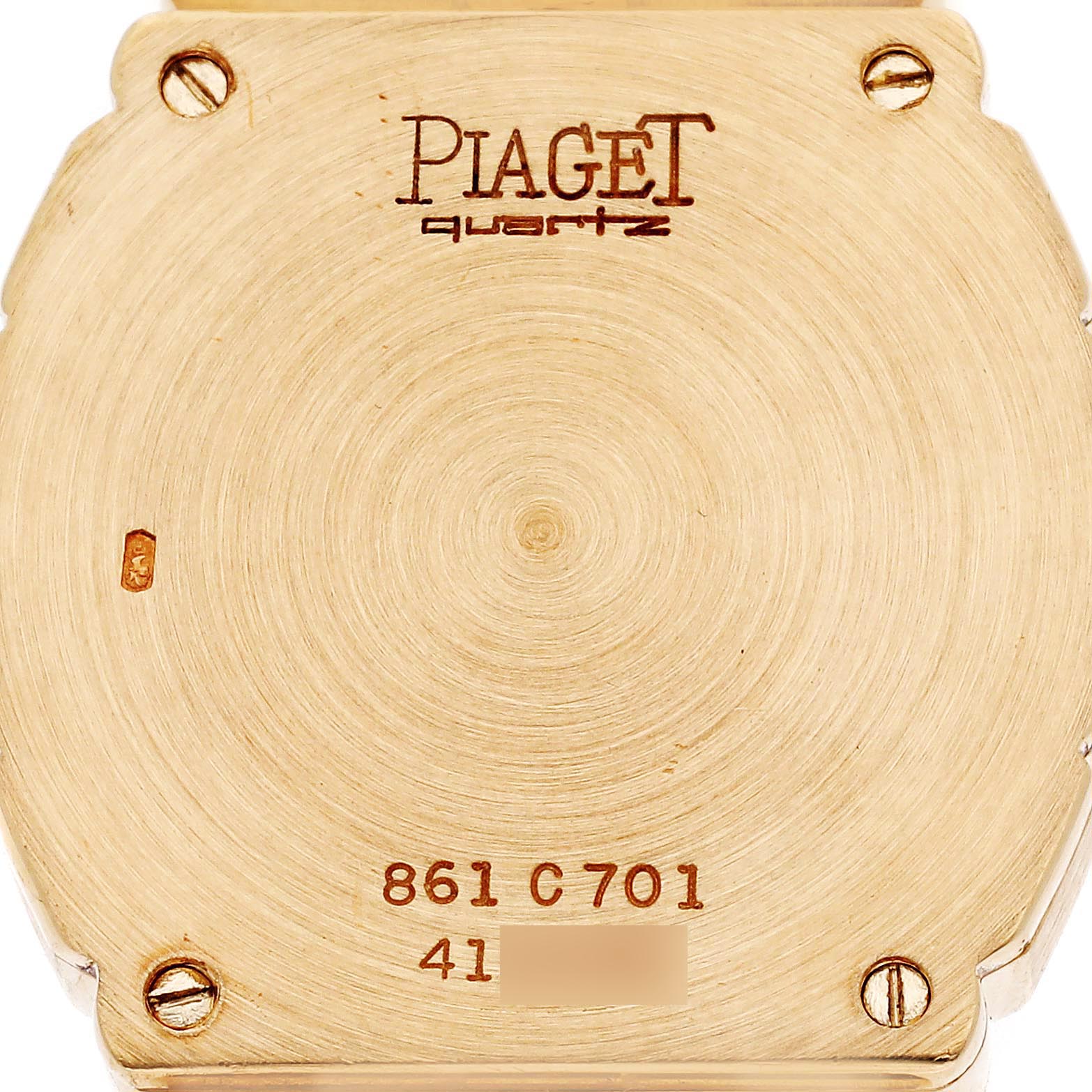 The image shows the back case of a Piaget 8610701 Women
s Yellow Gold Mother of Pearl Dial 8610701 Women
s Yellow Gold Mother of Pearl Dial Polo Yellow Gold Mother of Pearl Dial Ladies Watch, model 8610701, featuring the brand and model engraving.