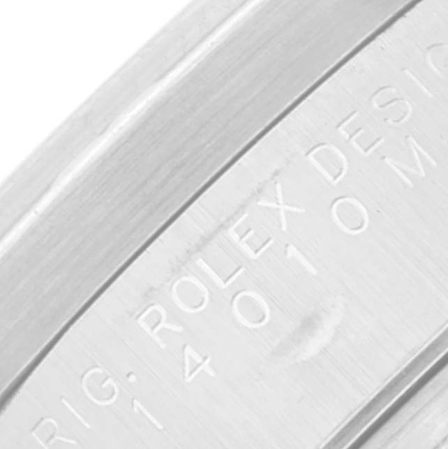 The image shows an extreme close-up of the engraved side of the bezel or case of a Rolex Air-King 14010 Men's Stainless Steel Silver Dial 14010 Men's Stainless Steel Silver Dial watch.