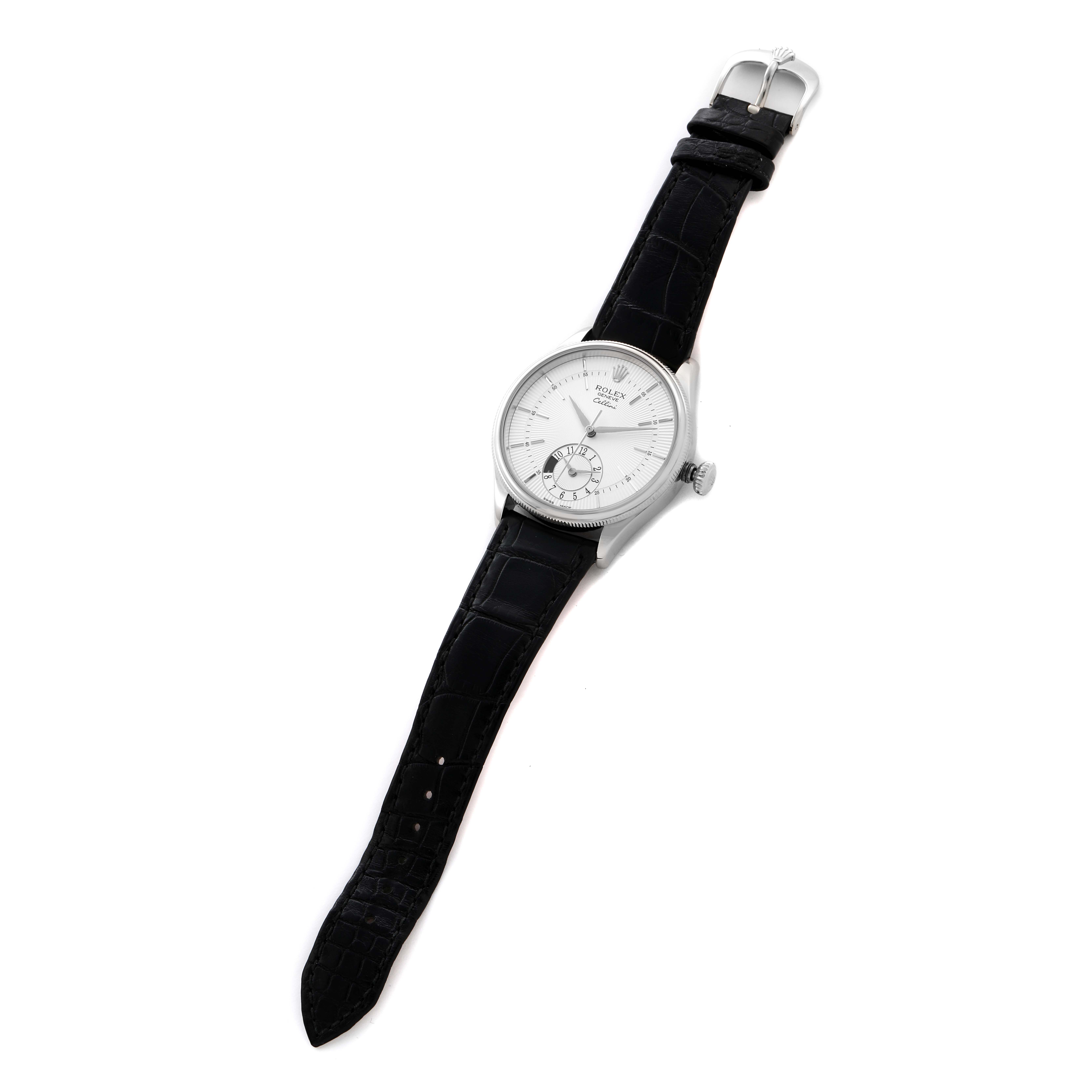 The Rolex Cellini 50529 Men
s White Gold Silver Dial 50529 Men
s White Gold Silver Dial watch is shown from a top-down angle, highlighting its face, black leather strap, and buckle.