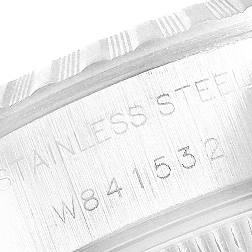 This close-up image shows the edge of the casing and part of the inscription on the bezel of a Rolex Datejust 69240  Women
s Stainless Steel Silver Dial 69240  Women
s Stainless Steel Silver Dial watch.