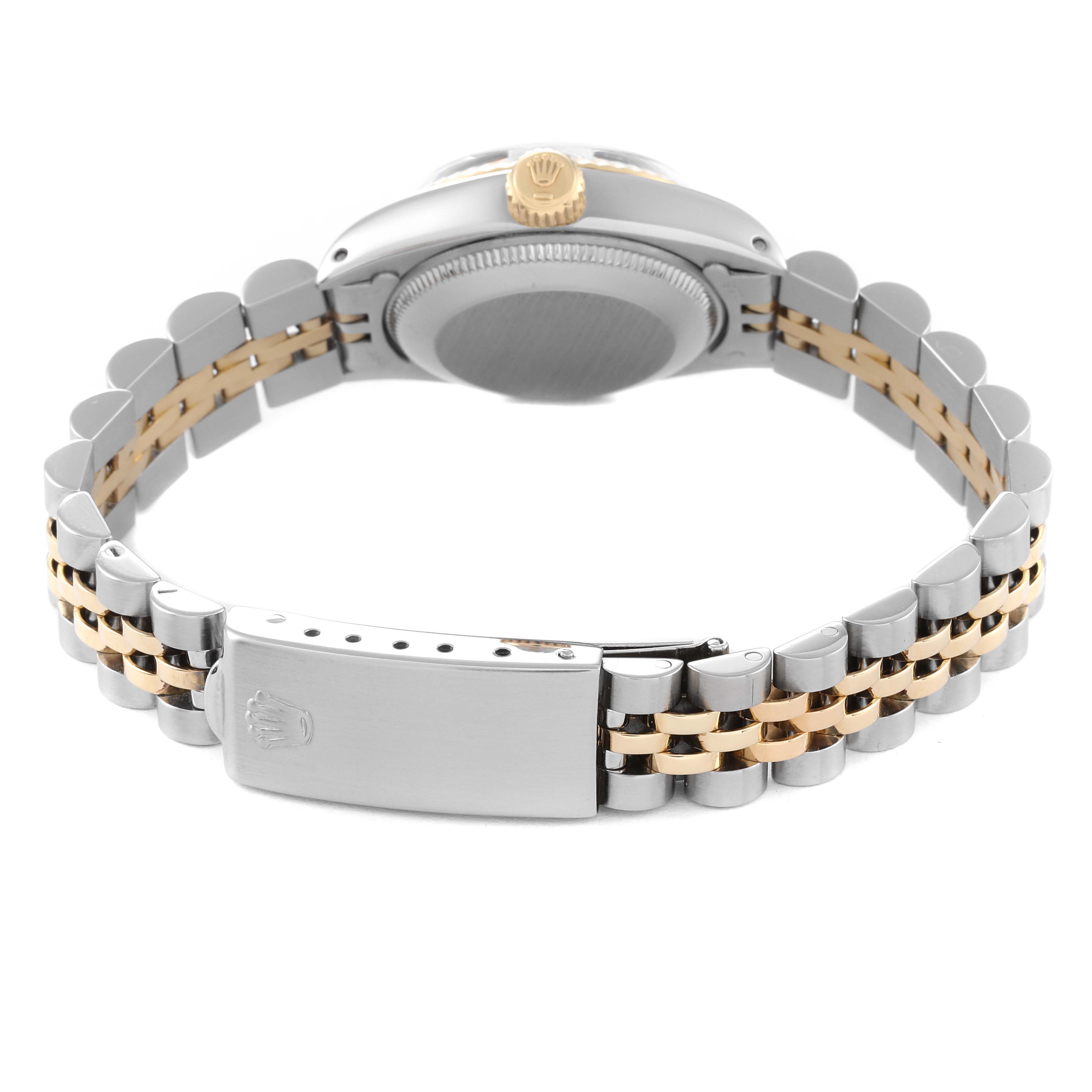 The image shows the back view of a Rolex Date 6917 Women's Steel and Gold (two tone) Champagne Dial 6917 Women's Steel and Gold (two tone) Champagne Dial model watch, highlighting the two-tone bracelet, clasp, and case back.