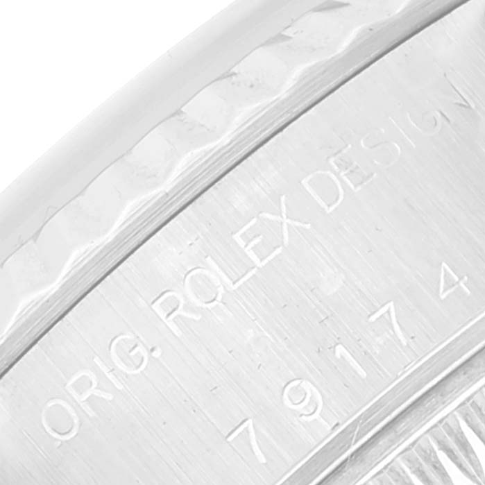 The image shows a close-up of the case side engraving on a Rolex Datejust 79174 Women's Stainless Steel Silver Dial 79174 Women's Stainless Steel Silver Dial watch.