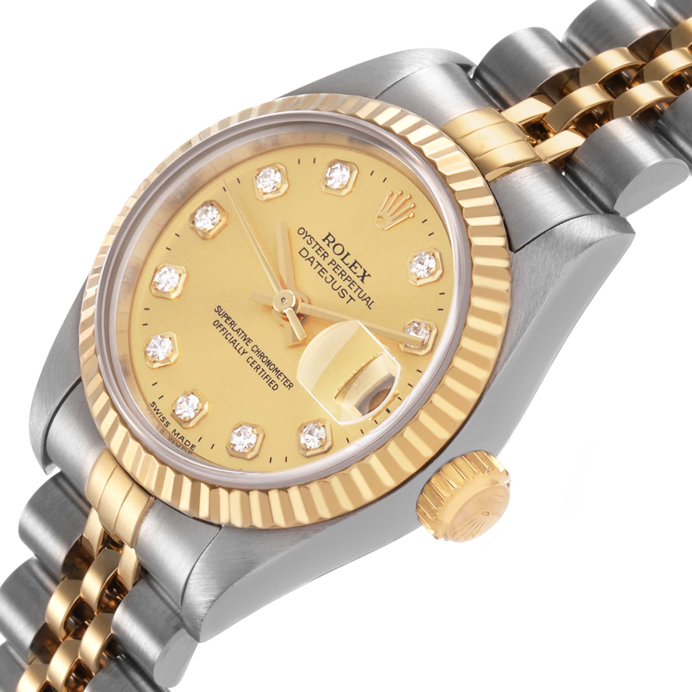 The Rolex Datejust 69173 Women's Steel and Gold (two tone) Champagne Dial watch is shown at an angled view highlighting the dial, fluted bezel, and two-tone bracelet.