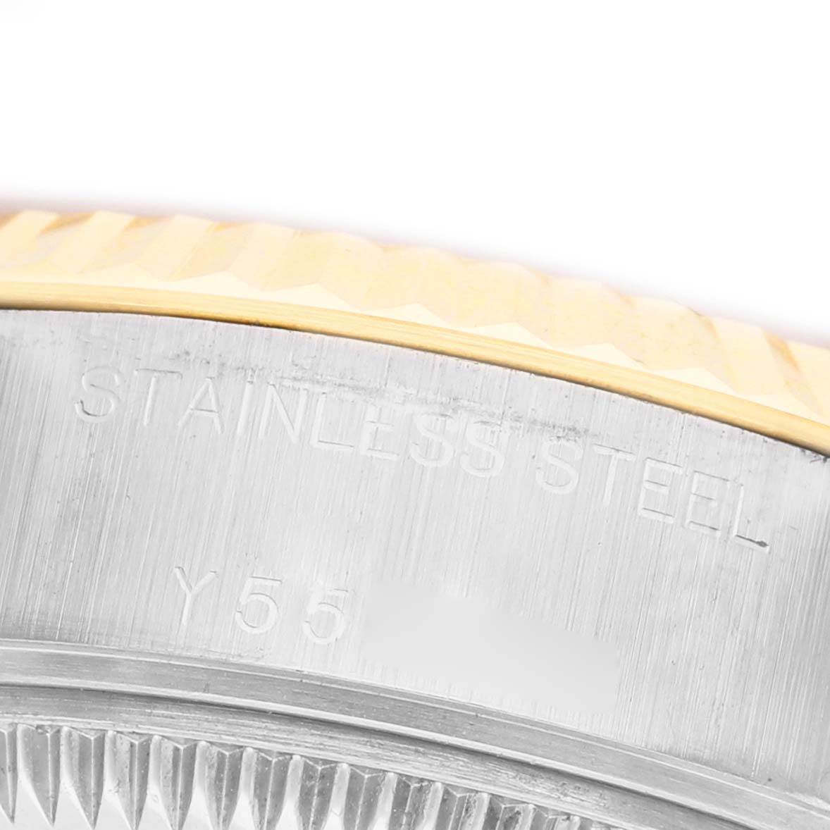 The image shows a close-up of the Rolex Datejust 79173 Women's Stainless Steel Champagne Dial's side, highlighting the stainless steel case and textured bezel.