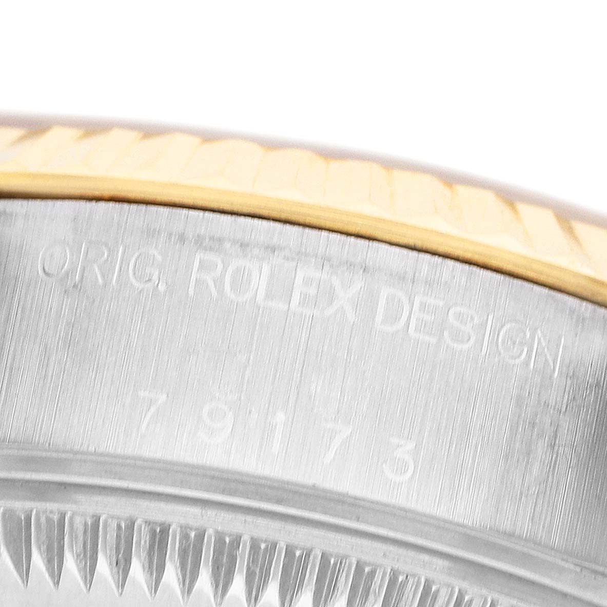 The image shows a close-up of the side of a Rolex Datejust 79173 Women's Steel and Gold (two tone) Champagne Dial, highlighting the engraved model number.