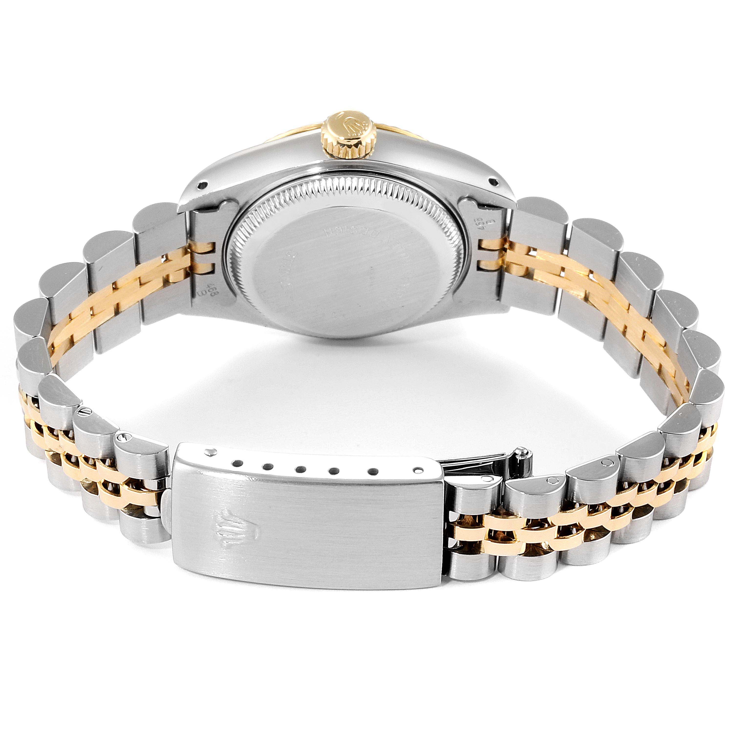 This image shows the back case, crown, and two-tone jubilee bracelet of a Rolex Datejust 69173 Women
s Steel and Gold (two tone) Champagne Dial 69173 Women
s Steel and Gold (two tone) Champagne Dial model.