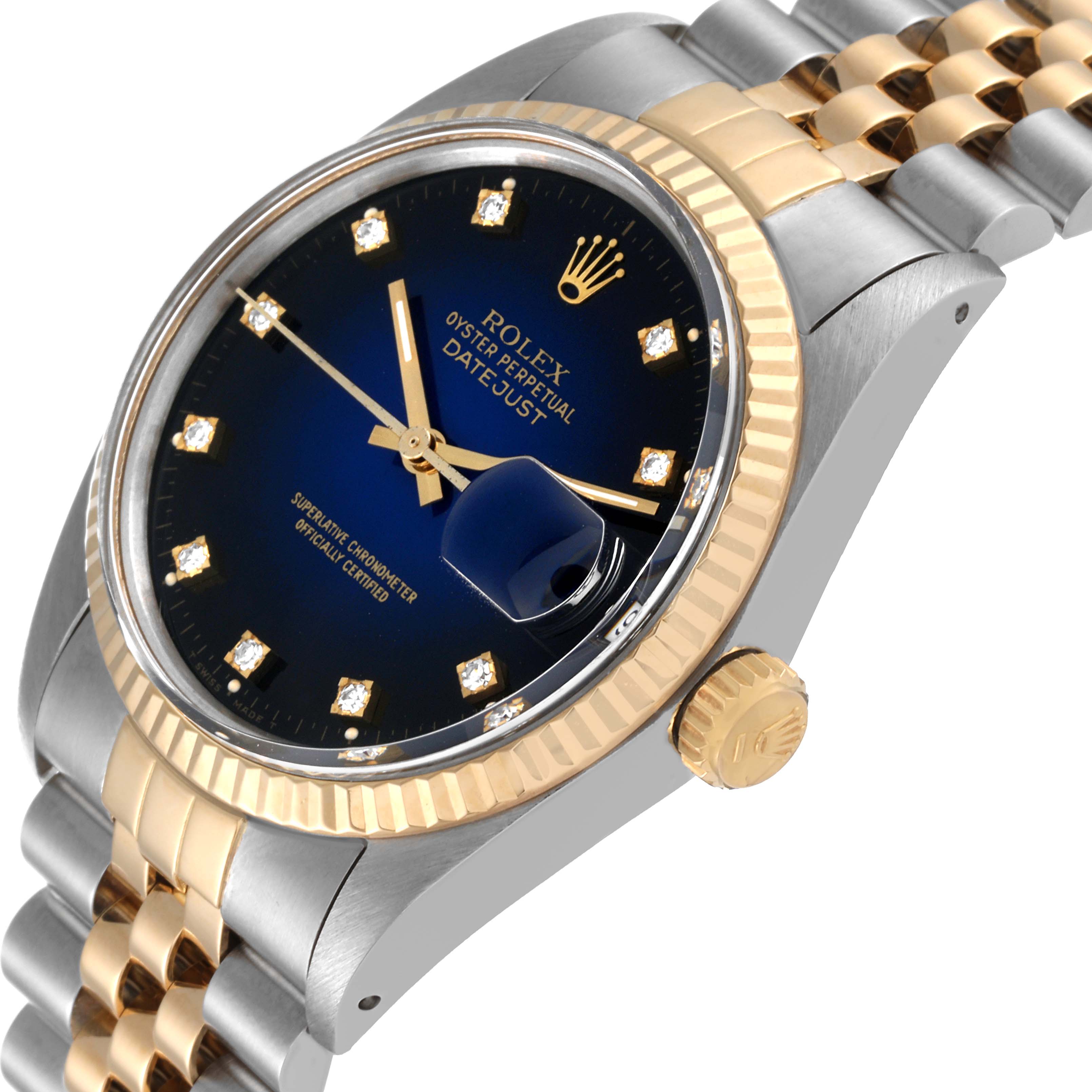 This image shows a side angle of a Rolex Vintage Collection 16013 Men's Steel and Gold (two tone) Blue Dial 16013 Men's Steel and Gold (two tone) Blue Dial Oyster Perpetual Datejust watch, highlighting the dial, bezel, and crown.