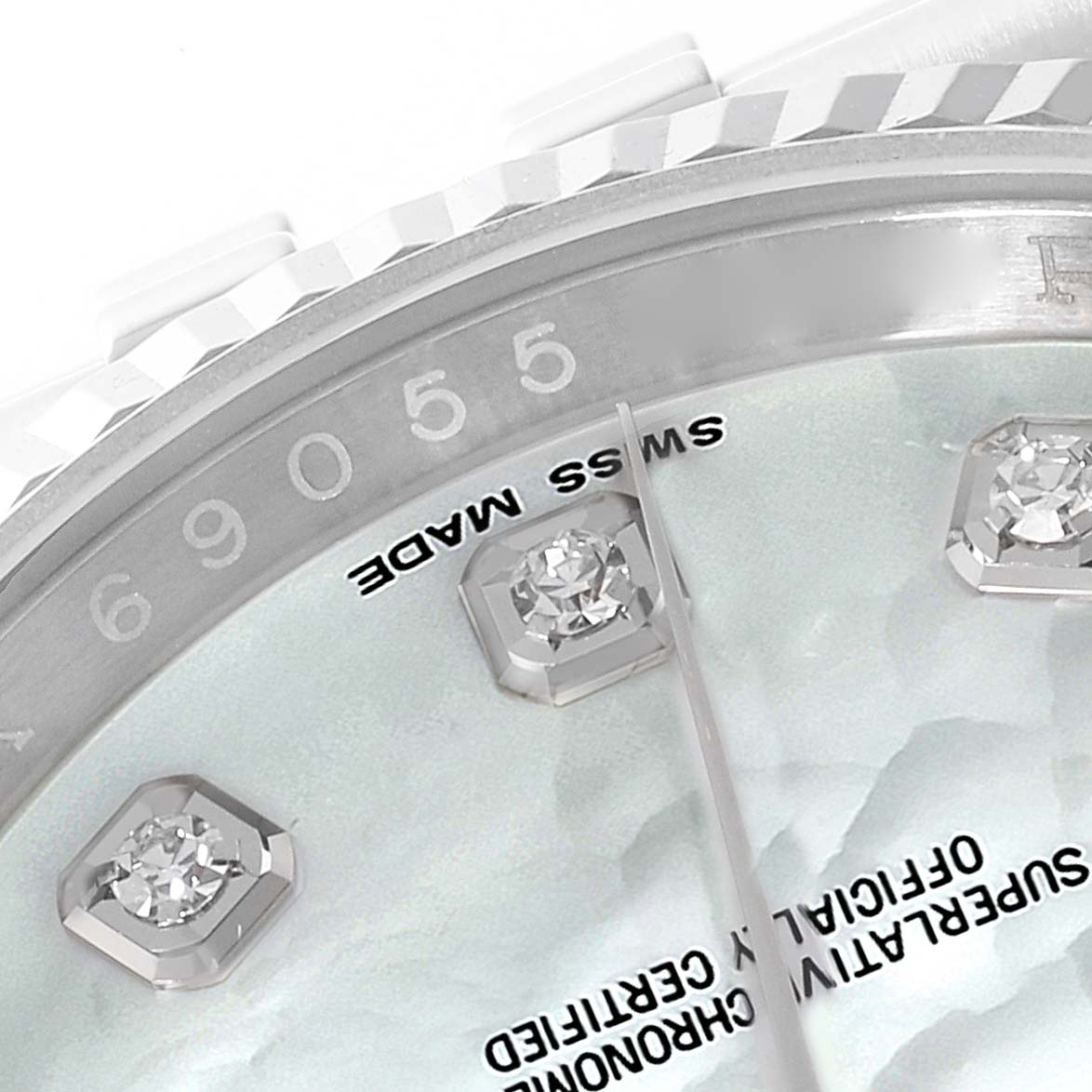 The image shows a macro view of the Rolex Datejust 116234 Men's Stainless Steel Mother of Pearl Dial 116234 Men's Stainless Steel Mother of Pearl Dial's dial and part of the bezel, displaying diamond hour markers and the "Swiss Made" text.