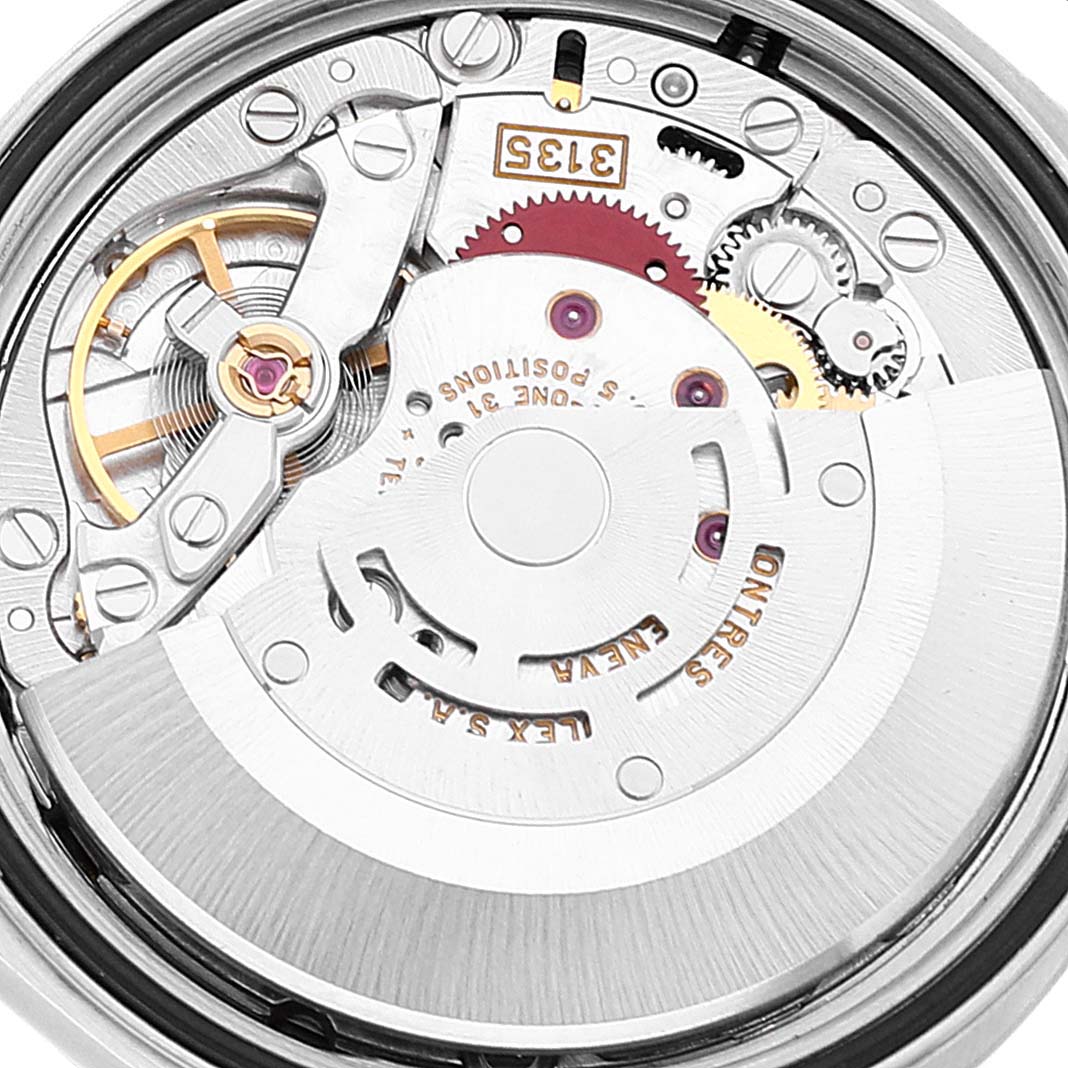 The image shows a close-up view of the Rolex Datejust 16234 Men's Stainless Steel Blue Dial 16234 Men's Stainless Steel Blue Dial's internal movement mechanism from the back.