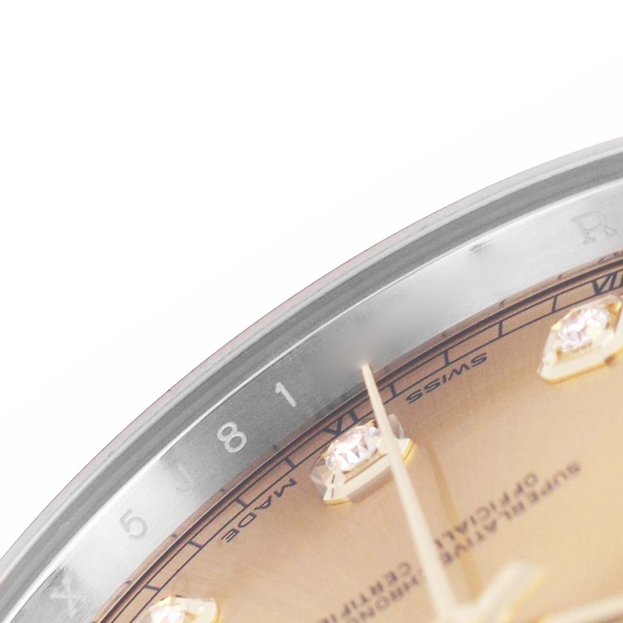The image shows a close-up of the bezel, part of the dial, and diamond markers on the Rolex Datejust 41 M126333-0011 Men's Steel and Gold (two tone) Champagne Dial watch.