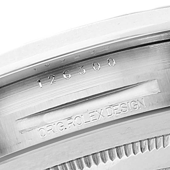 This image shows a close-up of the serial number and "ORIG. ROLEX DESIGN" engraving on the casing of a Rolex Datejust 41 126300 Men
s Stainless Steel Grey Dial 126300 Men
s Stainless Steel Grey Dial watch.