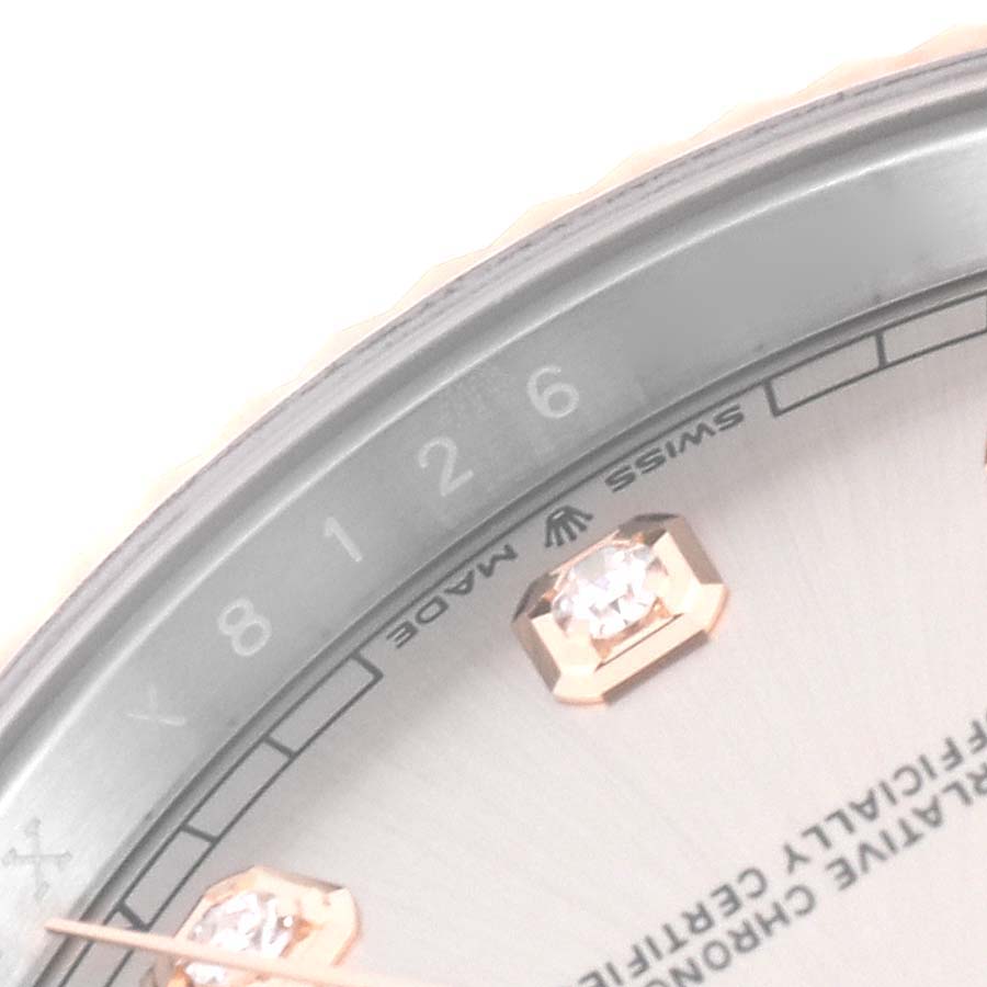 This image shows a close-up of the dial and bezel of the Rolex Datejust 41 126331 Men's Steel and Gold (two tone) Pink Dial 126331 Men's Steel and Gold (two tone) Pink Dial, focusing on the diamond markers and "Swiss Made" text.