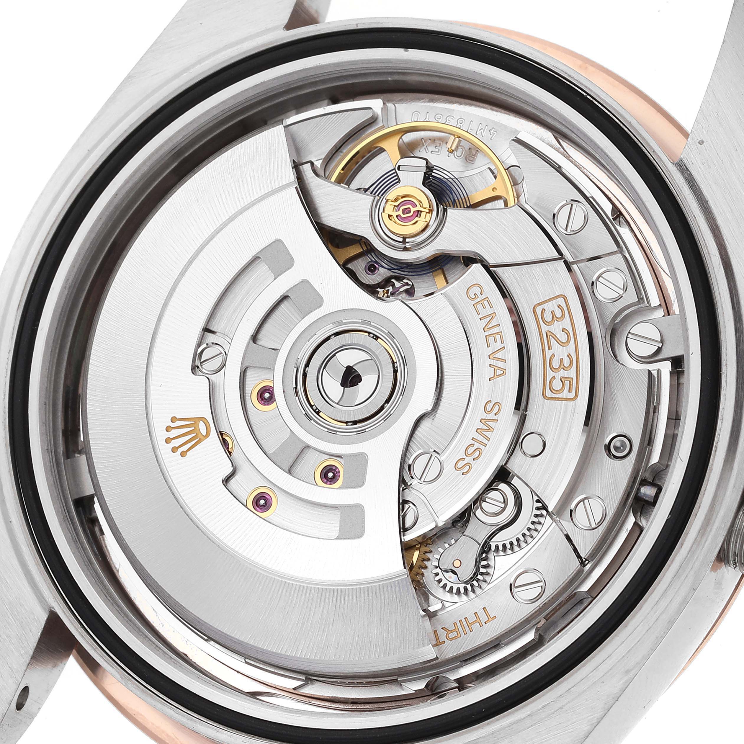 This image shows the movement mechanism of the Rolex Datejust 41 126331 Men's Steel and Gold (two tone) Pink Dial 126331 Men's Steel and Gold (two tone) Pink Dial watch from a rear angle, highlighting the intricate components.