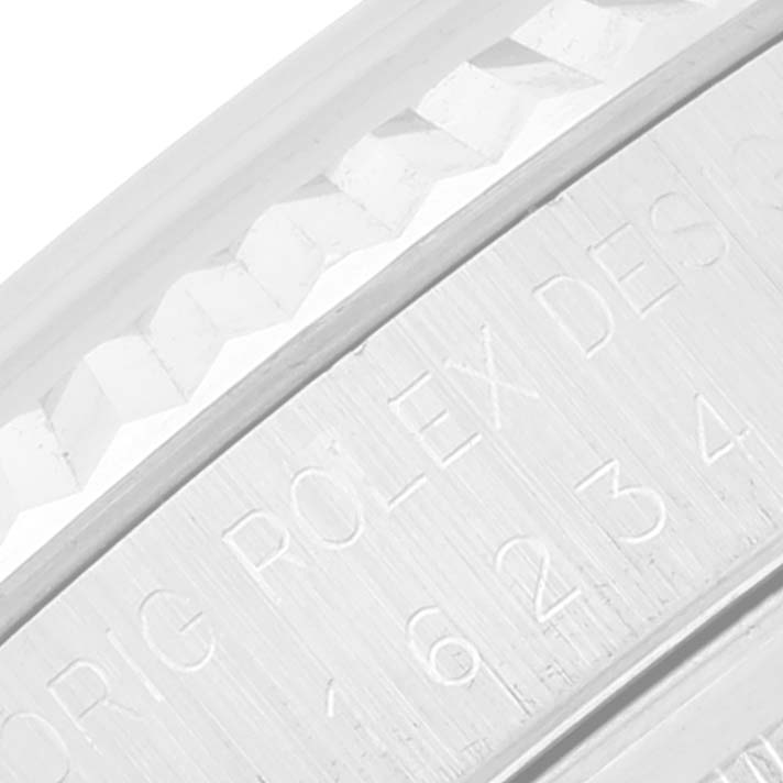 This close-up shows the marked bezel and fluted edge of the Rolex Datejust 16234 Men's Stainless Steel Blue Dial 16234 Men's Stainless Steel Blue Dial watch.