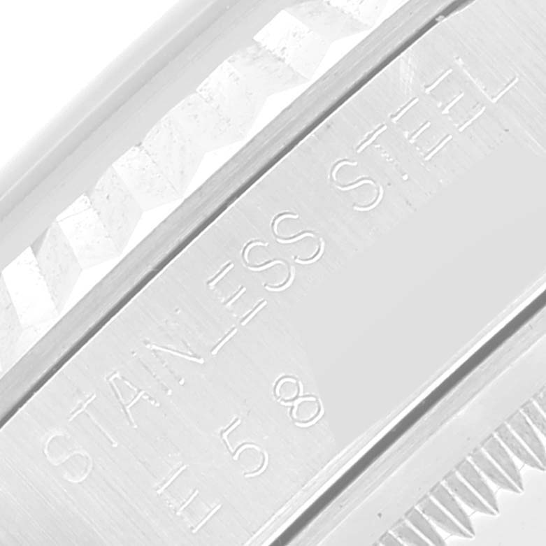 The image shows a close-up of the case back and serial number on a Rolex Datejust 16234 Men's Stainless Steel Blue Dial 16234 Men's Stainless Steel Blue Dial watch.