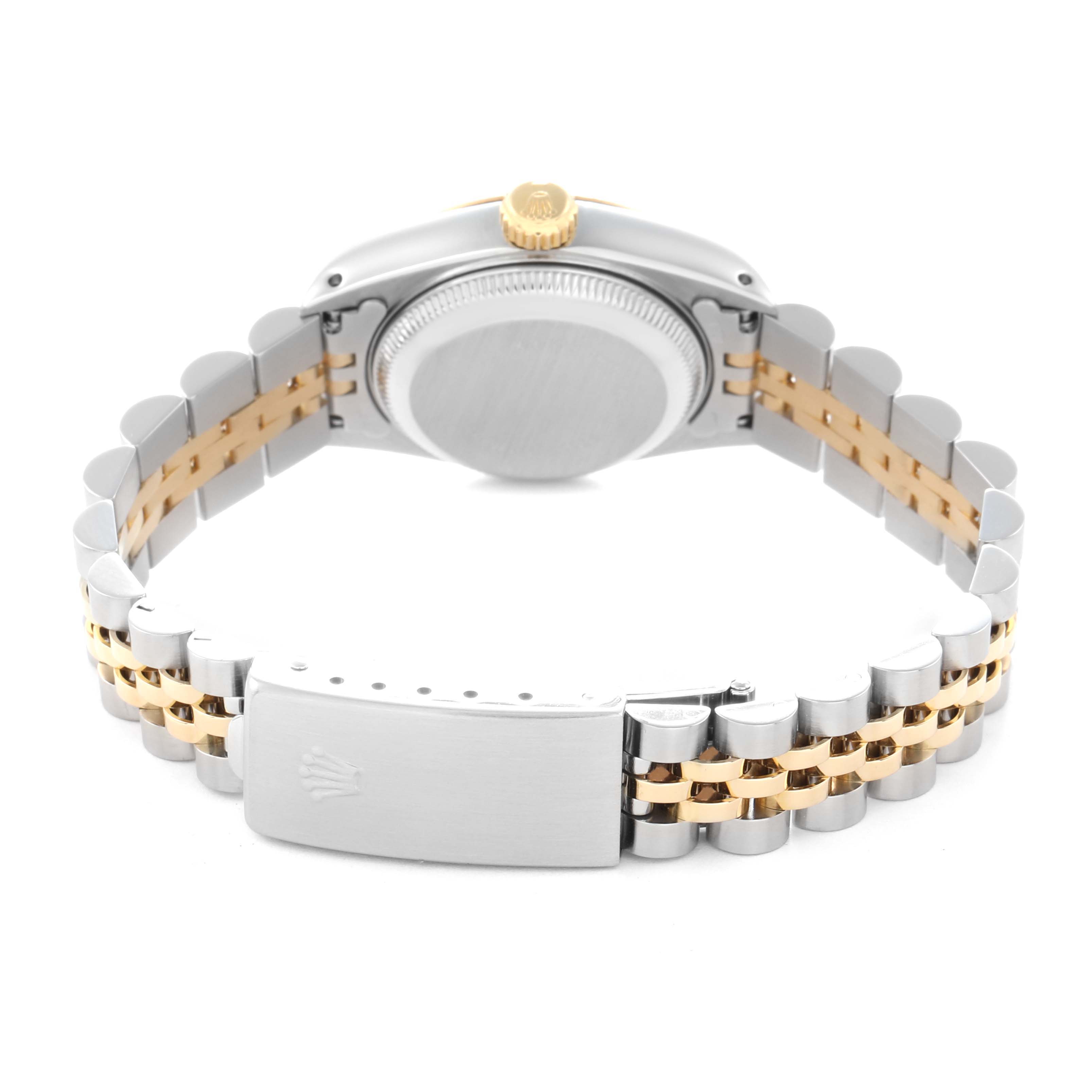 The image shows the back view of a Rolex Datejust 69173 Women
s Steel and Gold (two tone) Champagne Dial 69173 Women
s Steel and Gold (two tone) Champagne Dial, highlighting the case back, crown, and two-tone bracelet with clasp.