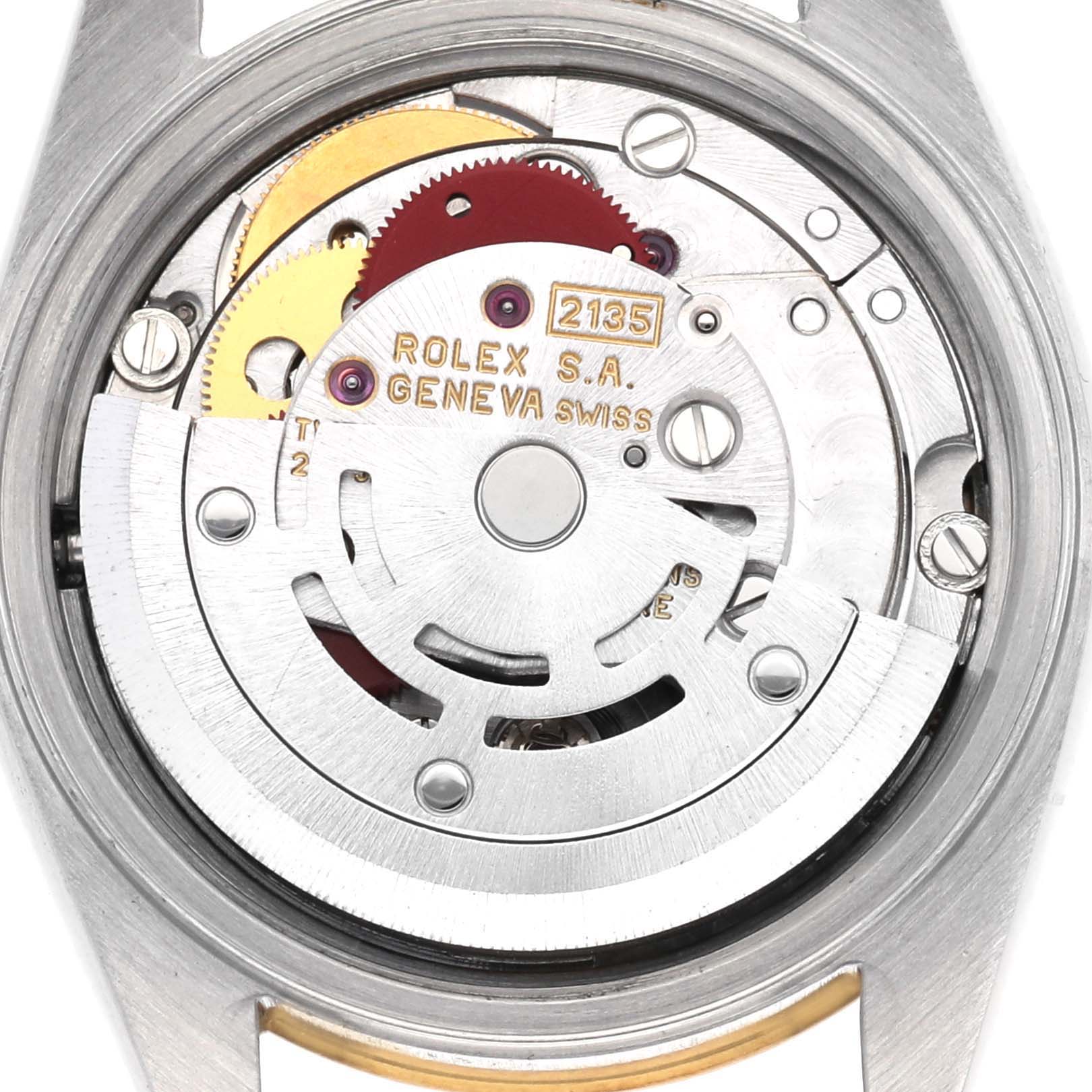 The image shows the movement of a Rolex Datejust 69173 Women
s Steel and Gold (two tone) Champagne Dial 69173 Women
s Steel and Gold (two tone) Champagne Dial watch, highlighting the rotor and gears from a top-down perspective.