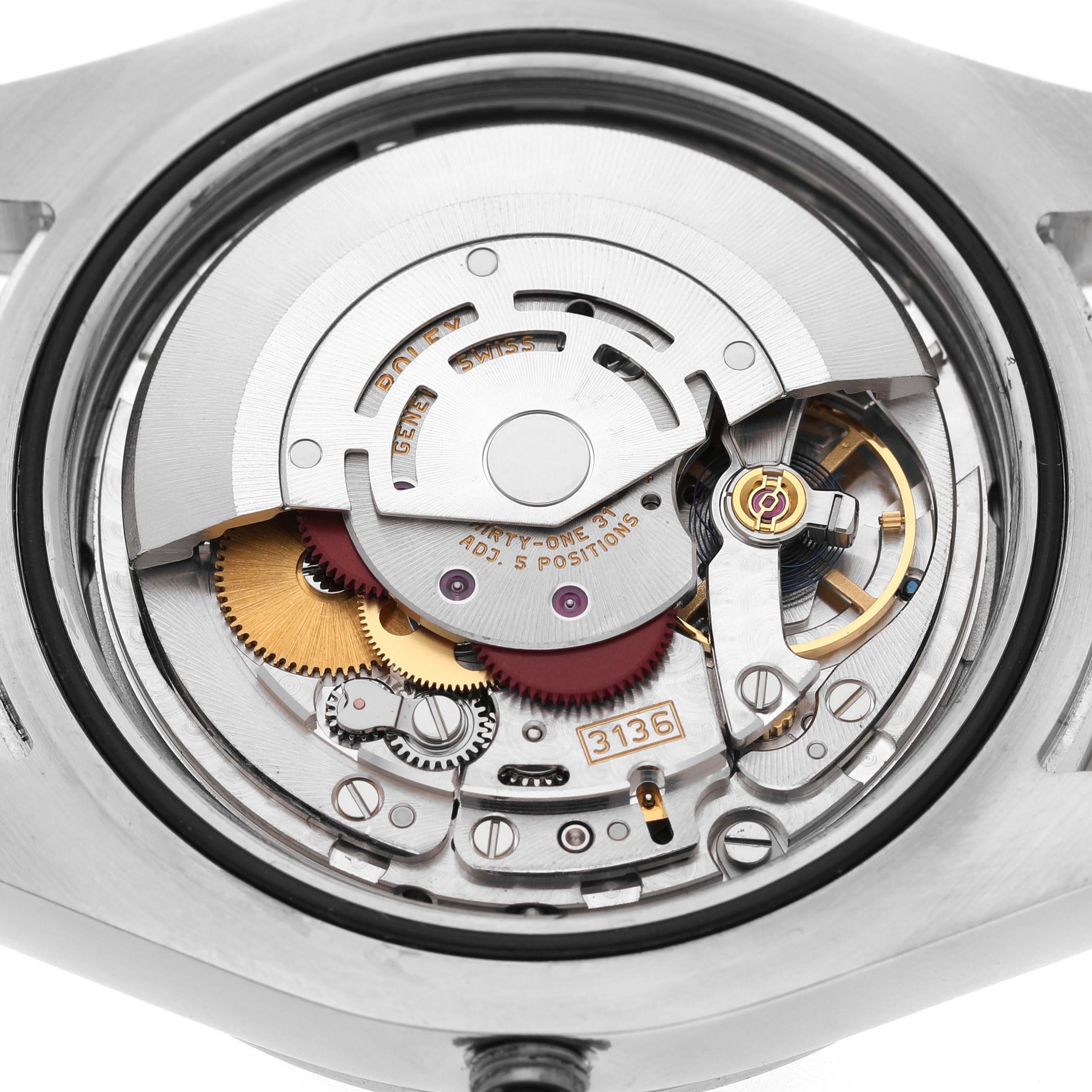 The image shows the Rolex Datejust 41 116334 Mens Stainless Steel White Dials movement from the back, highlighting gears and internal components.