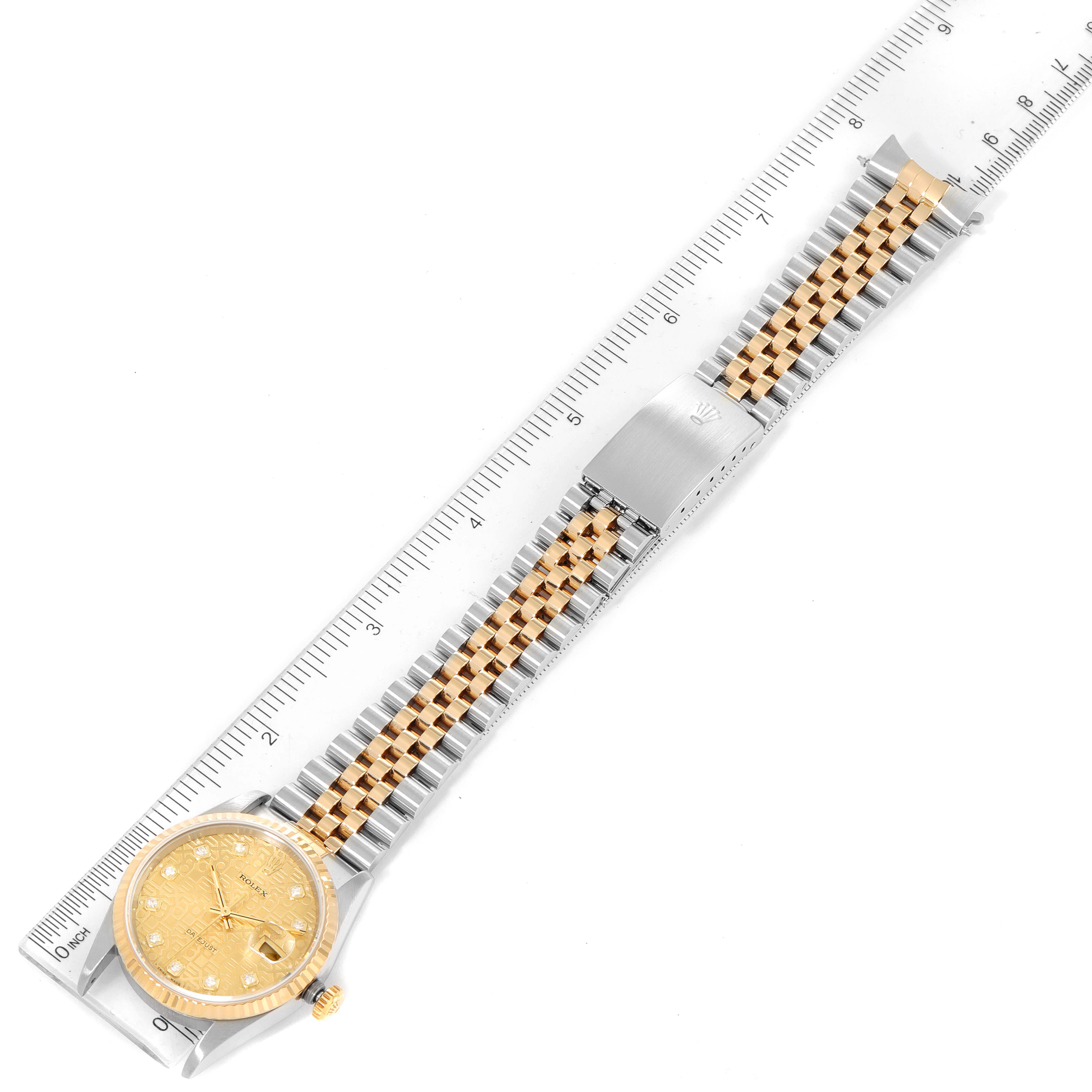 The image shows a Rolex Datejust 16233 Men's Steel and Gold (two tone) Champagne Dial 16233 Men's Steel and Gold (two tone) Champagne Dial watch from a top-down angle, highlighting its gold face and two-tone bracelet beside a ruler.
