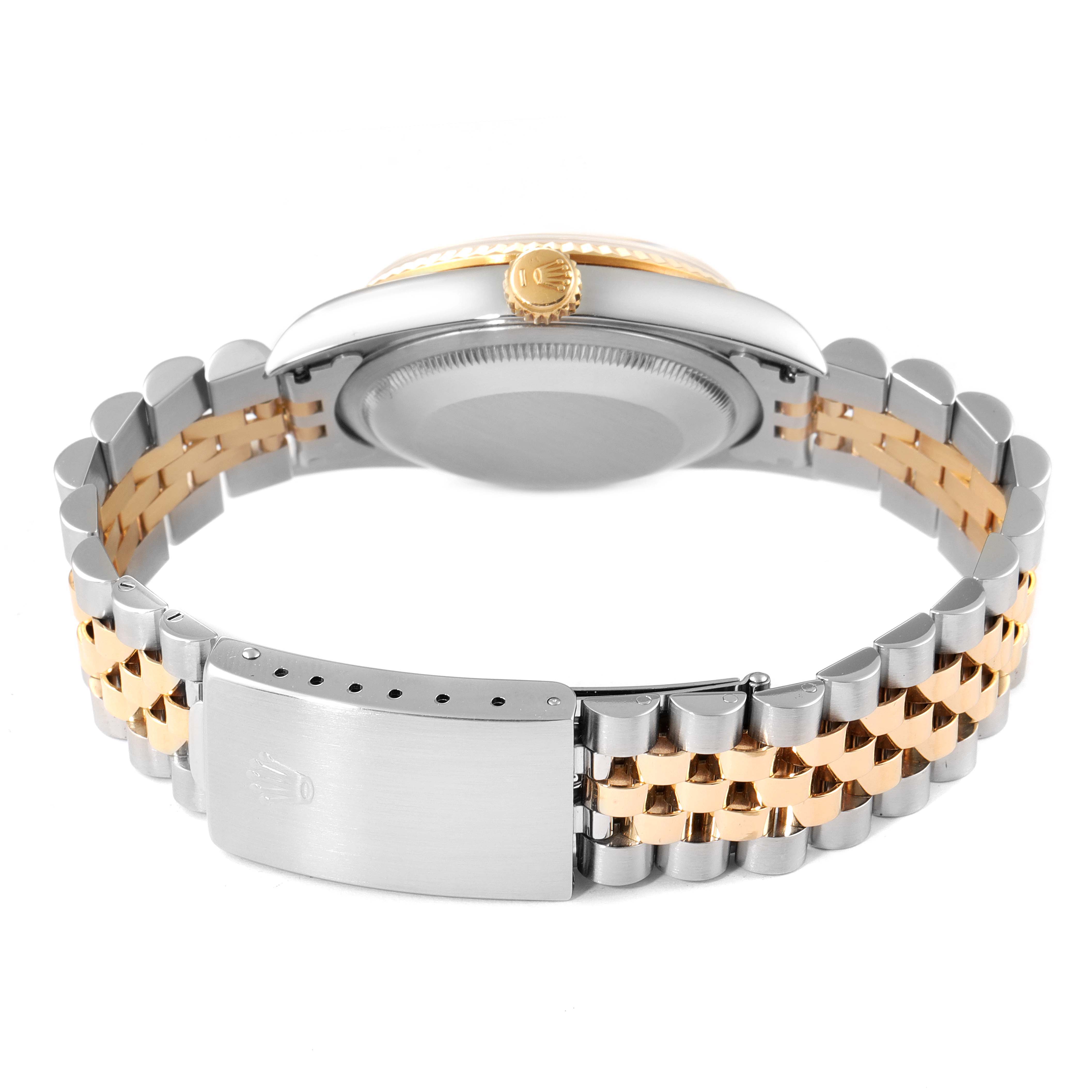 This image shows the back view of the case, crown, and two-tone bracelet of a Rolex Datejust 16233 Men's Steel and Gold (two tone) Champagne Dial 16233 Men's Steel and Gold (two tone) Champagne Dial watch.