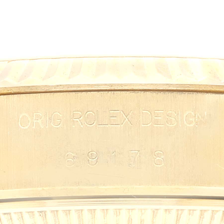 The image shows a close-up of the Rolex President 69178 Women
s Yellow Gold Champagne Dial 69178 Women
s Yellow Gold Champagne Dial watch
s bezel and engraving, highlighting the model number.