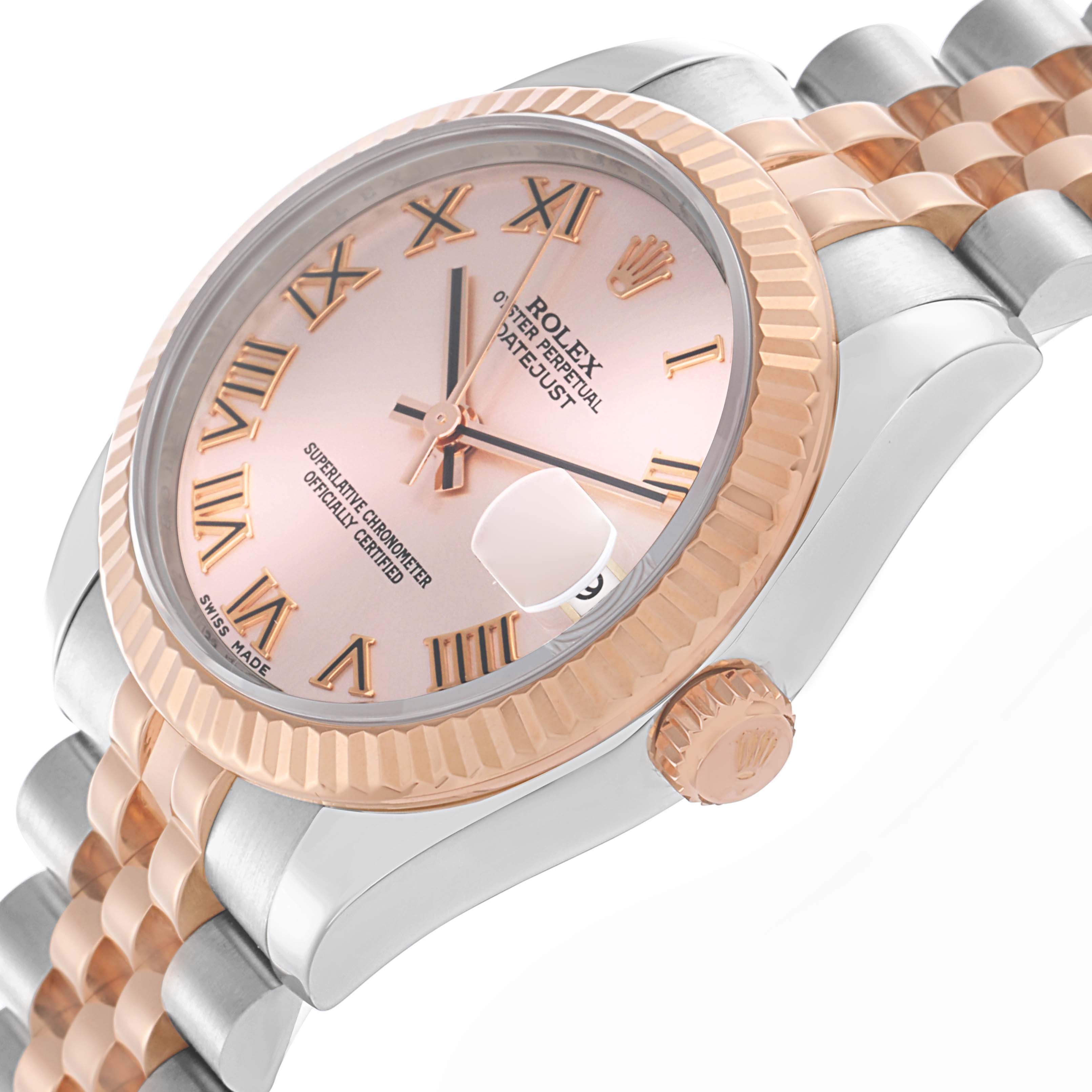 The Rolex Mid-Size 178271 Women
s Steel and Gold (two tone) Pink Dial 178271 Women
s Steel and Gold (two tone) Pink Dial watch is shown at an angle highlighting the face, fluted bezel, crown, and two-tone bracelet.