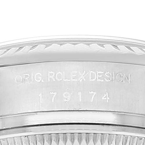 The image shows a close-up of the side of the bezel and case of a Rolex Datejust 179174 Women
s Stainless Steel Mother of Pearl Dial 179174 Women
s Stainless Steel Mother of Pearl Dial watch, including the engraving "ORIG. ROLEX DESIGN" and the model number.