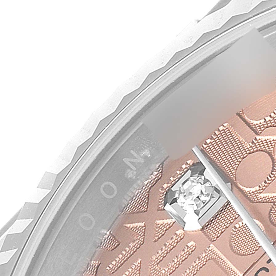 This image shows a close-up of the bezel, dial, and diamond marker of a Rolex Datejust 126234 Men
s Stainless Steel Pink Dial 126234 Men
s Stainless Steel Pink Dial watch.