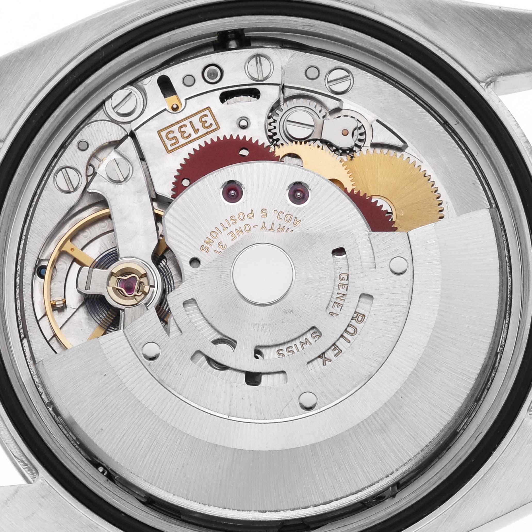 The image shows the movement mechanism of the Rolex Datejust 116233 Men
s Steel and Gold (two tone) Champagne Dial 116233 Men
s Steel and Gold (two tone) Champagne Dial from the back, highlighting gears and the rotor.