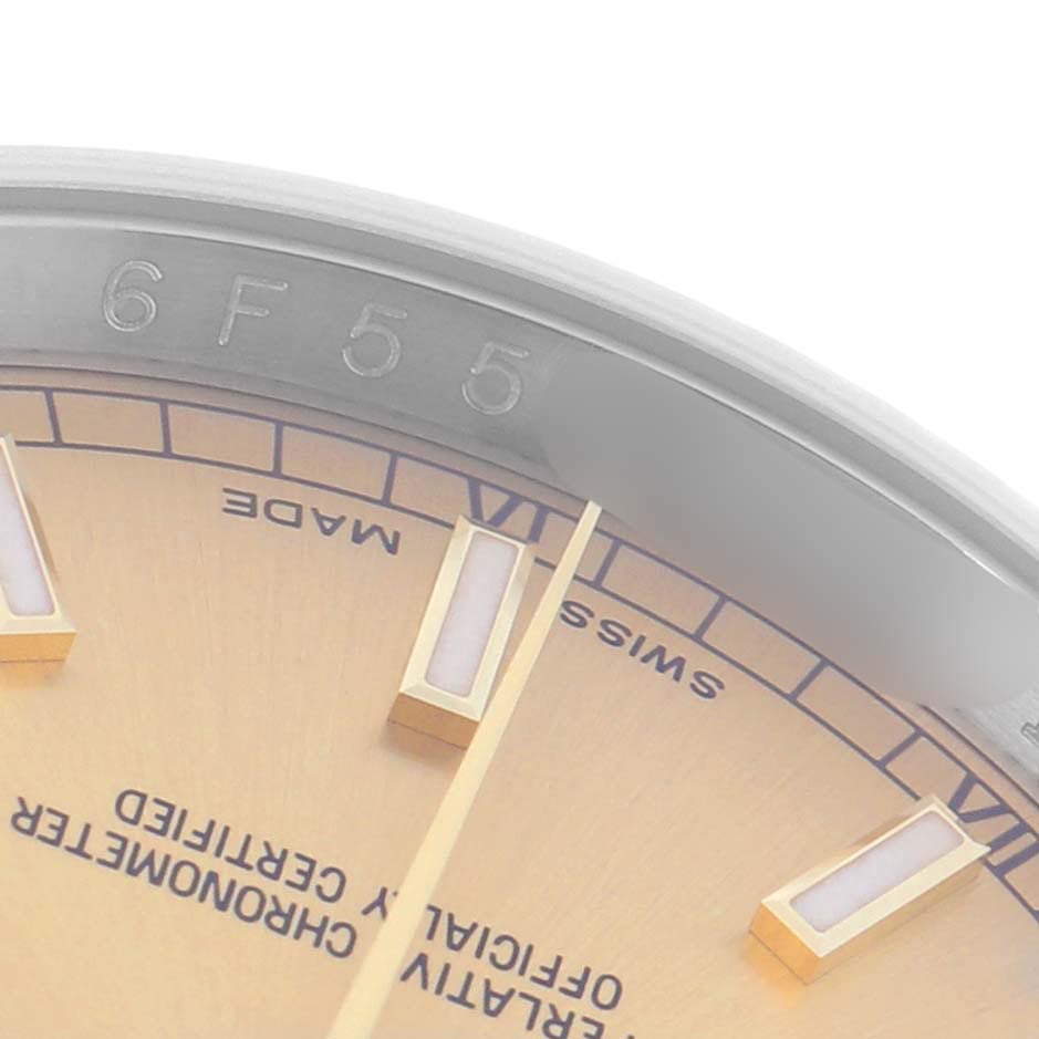 The image shows a close-up of the dial and bezel edge of a Rolex Datejust 116233 Men
s Steel and Gold (two tone) Champagne Dial 116233 Men
s Steel and Gold (two tone) Champagne Dial watch, focusing on markers and text details.
