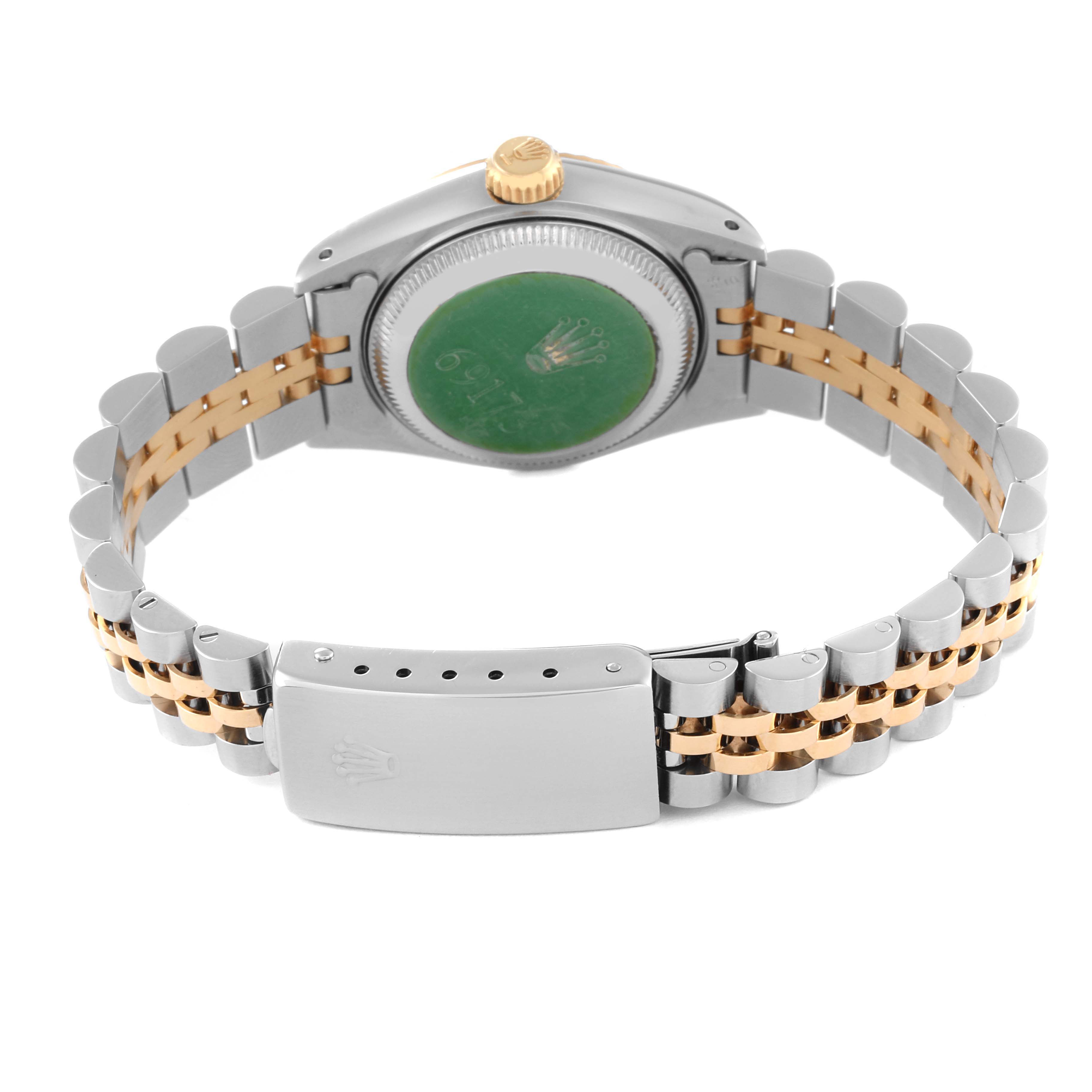 This Rolex Datejust 69173 Women's Steel and Gold (two tone) Champagne Dial 69173 Women's Steel and Gold (two tone) Champagne Dial watch is shown from the back, highlighting its case back, bracelet, and clasp.