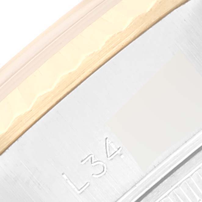 This image shows a close-up view of the bezel and edge of the dial from a Rolex Datejust 69173 Women's Steel and Gold (two tone) Champagne Dial 69173 Women's Steel and Gold (two tone) Champagne Dial.