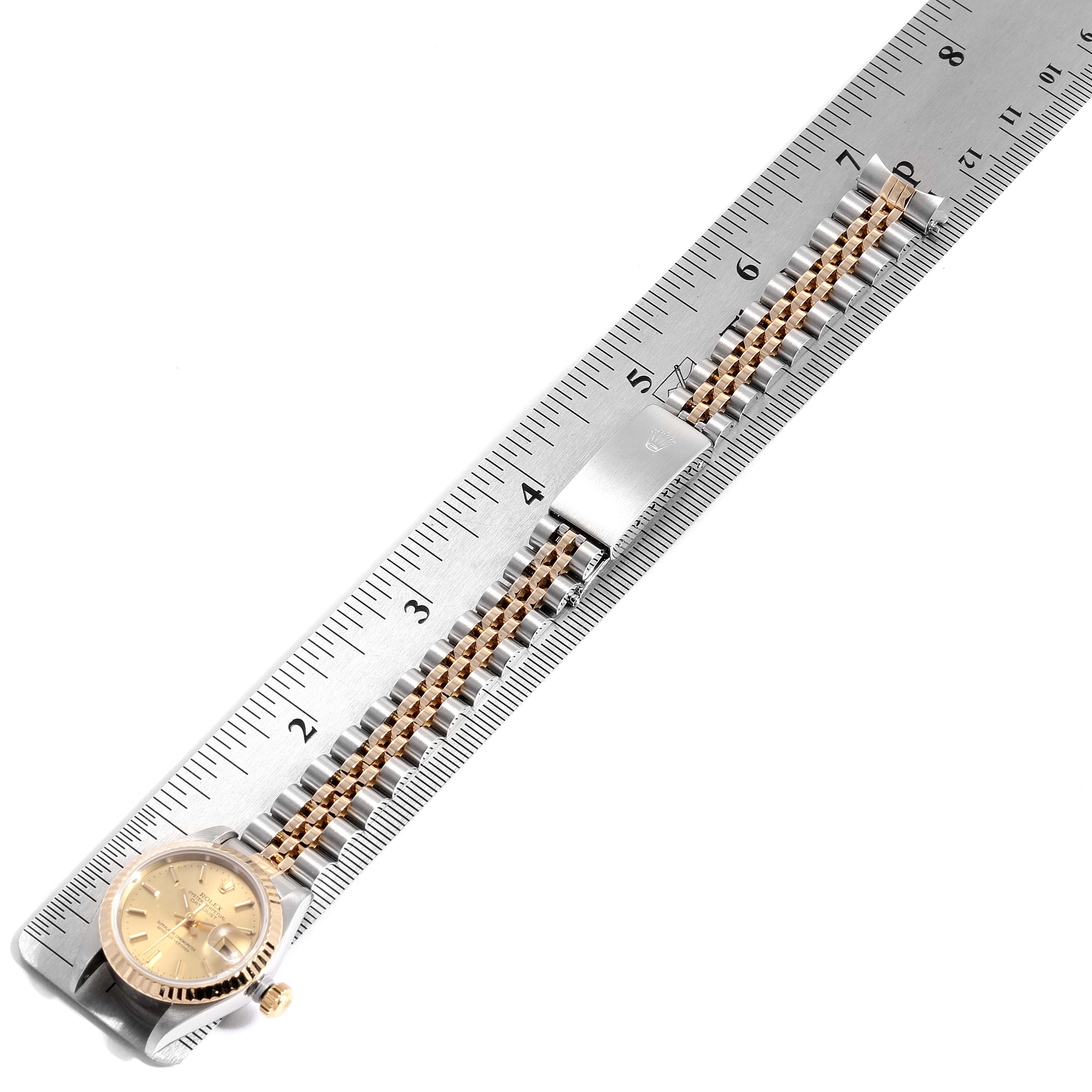 The Datejust model watch by Rolex is shown horizontally, including the dial, crown, and jubilee bracelet being measured.