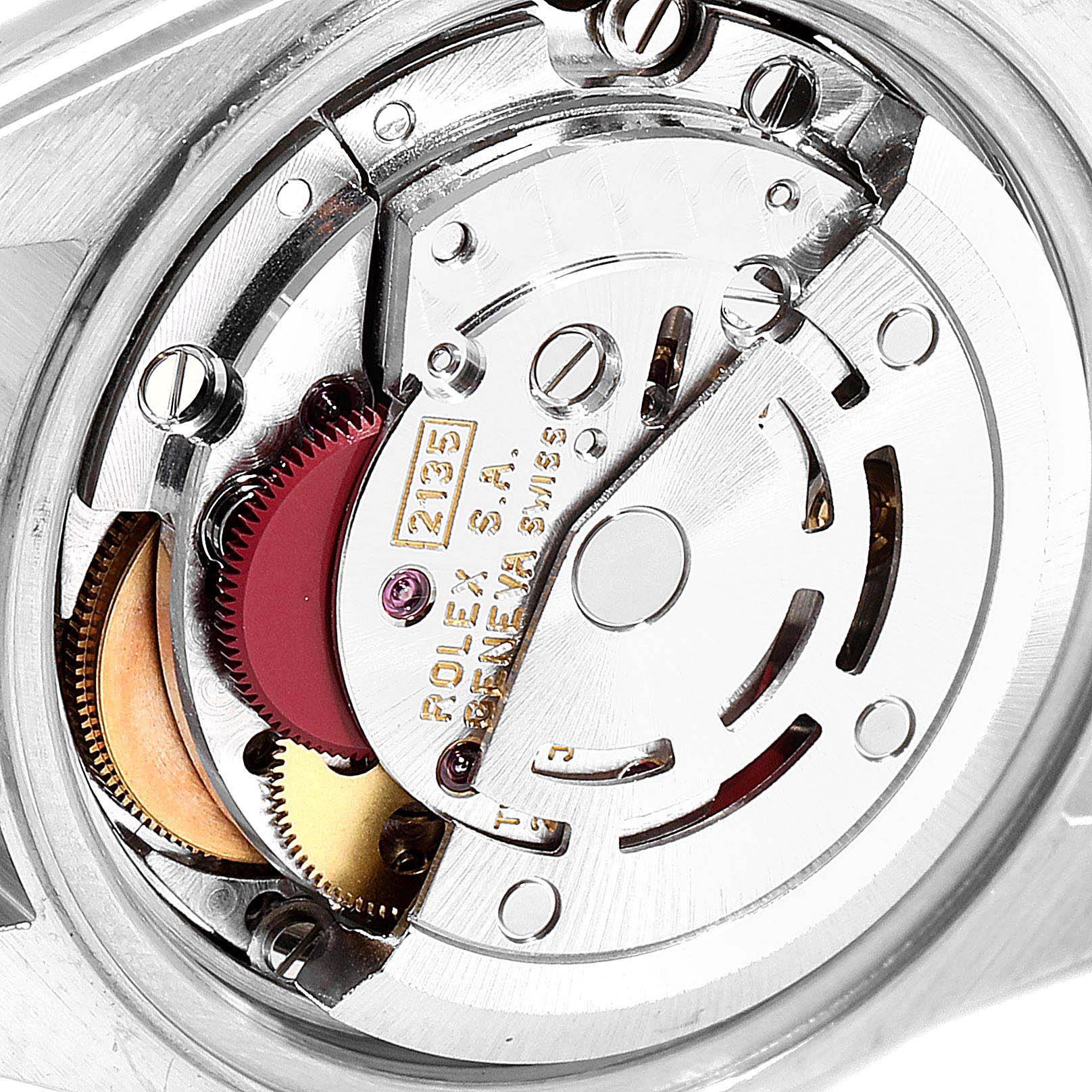 This close-up image shows the intricate internal movement of the Rolex Datejust 69173  Women
s Steel and Gold (two tone) Champagne Dial 69173  Women
s Steel and Gold (two tone) Champagne Dial watch
s mechanism from the back.